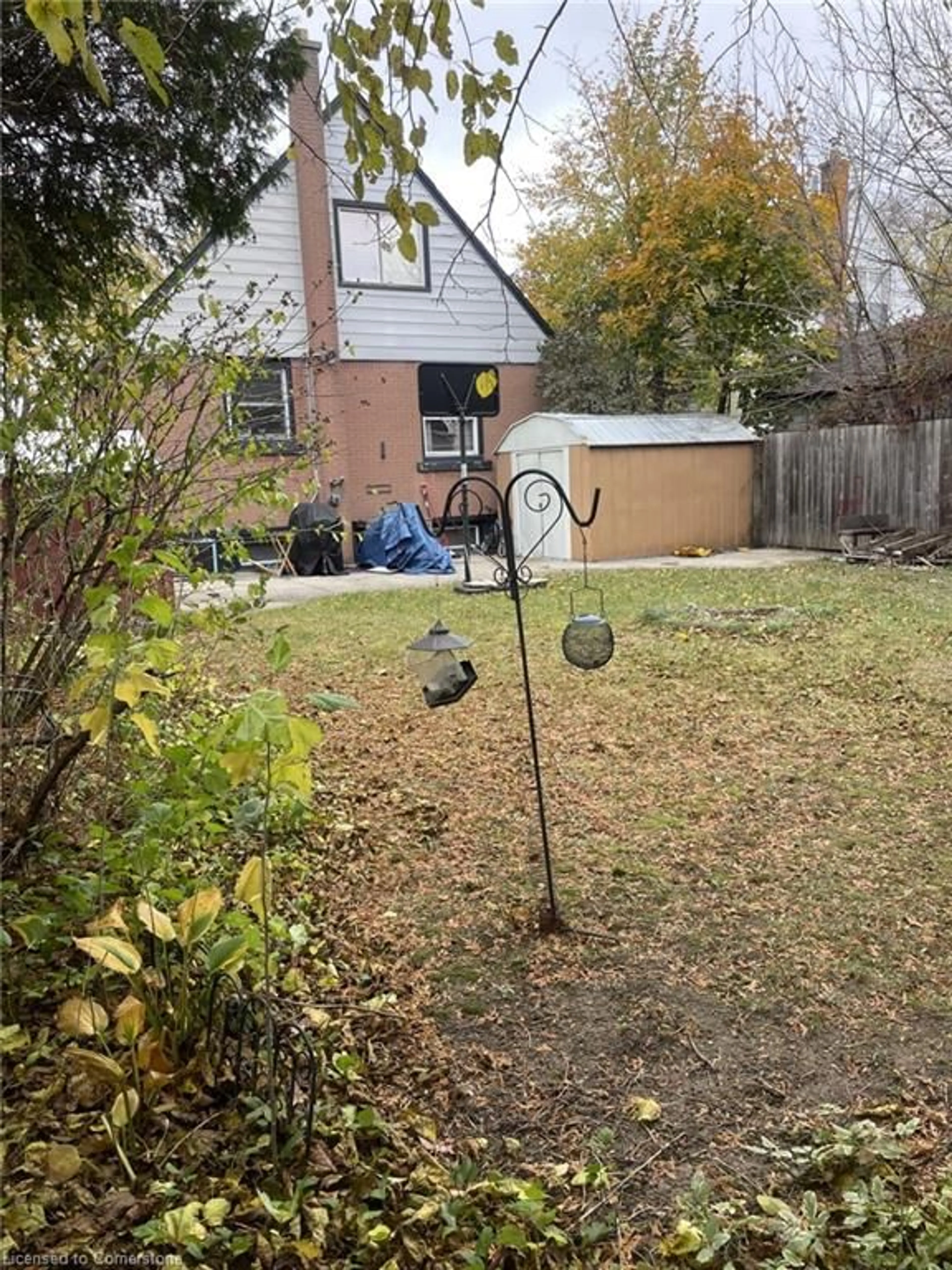 Frontside or backside of a home, the fenced backyard for 83 East 41st St, Hamilton Ontario L8T 2Z5