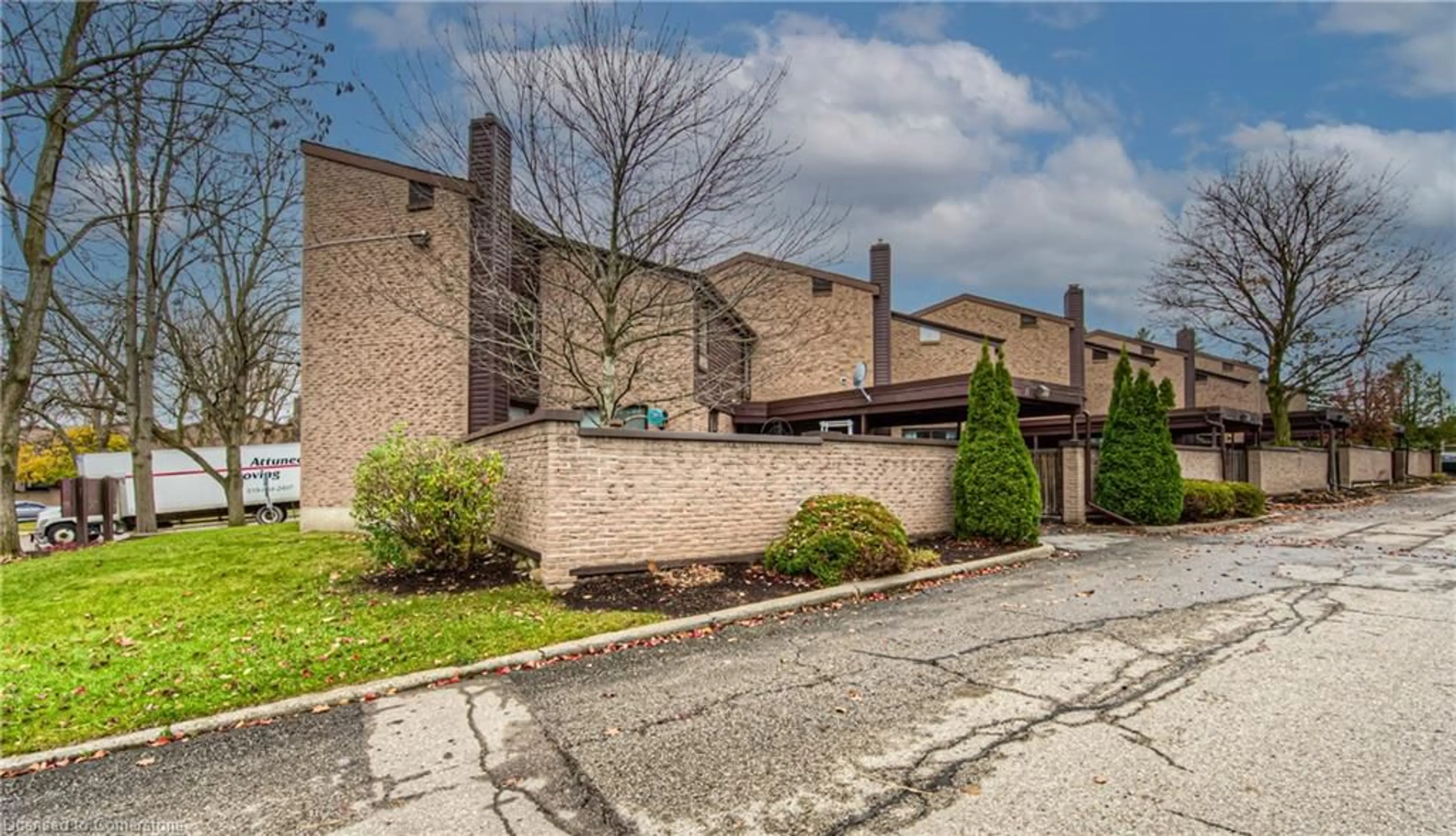 A pic from exterior of the house or condo, the fenced backyard for 28 Underhill Cres #11, Kitchener Ontario N2A 2S8