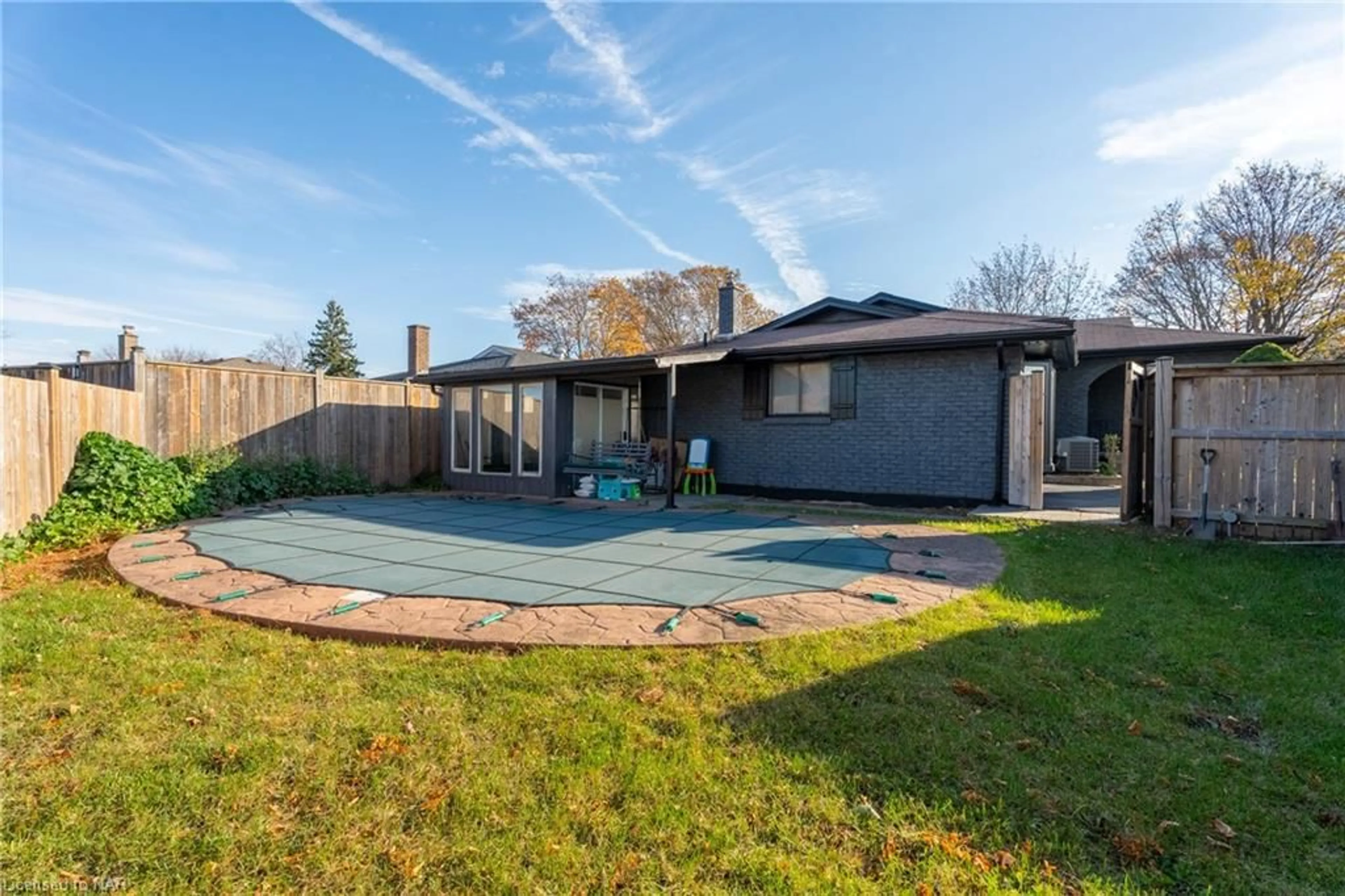 Frontside or backside of a home, the fenced backyard for 7229 Harriman St, Niagara Falls Ontario L2J 3W6