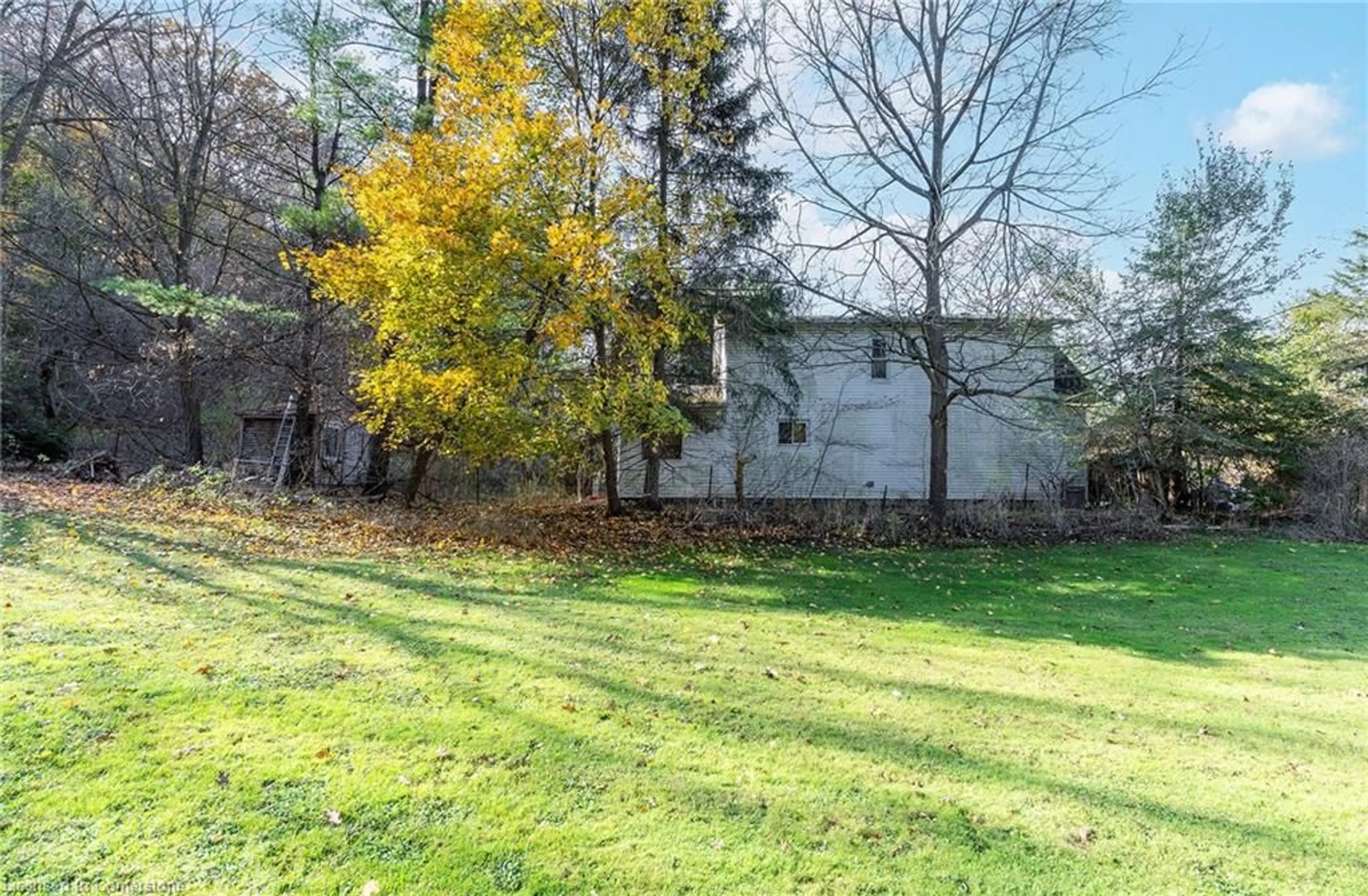 A pic from exterior of the house or condo, the fenced backyard for 1110 Wilson St, Ancaster Ontario L8S 4K5