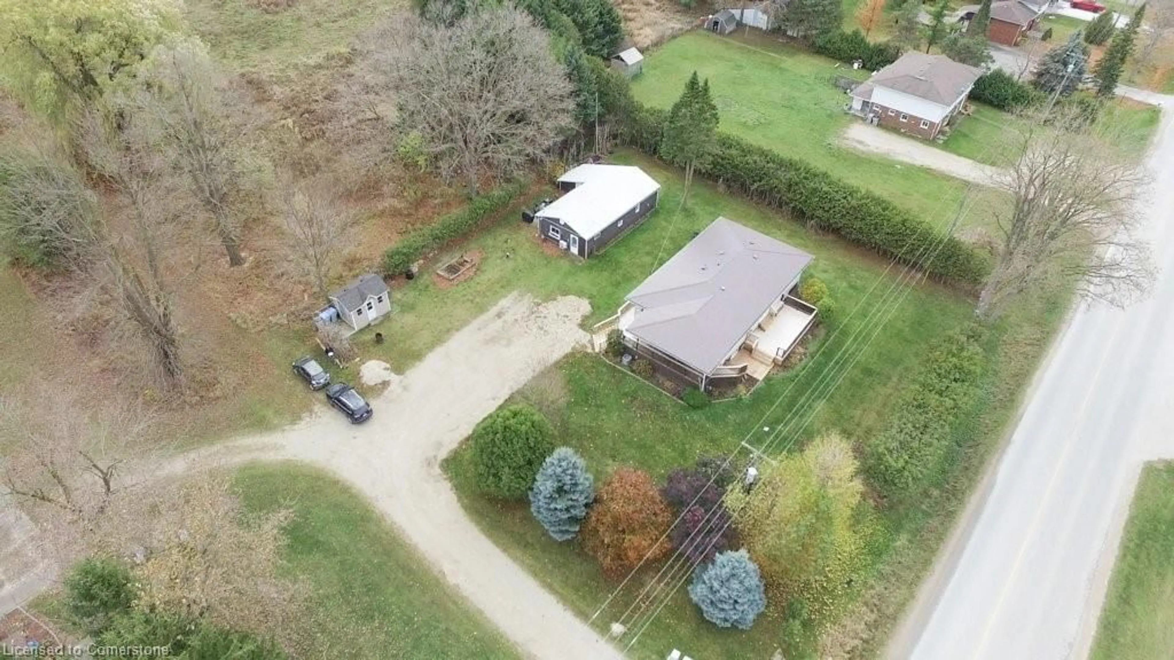 Frontside or backside of a home, the fenced backyard for 820 Tremaine Ave, Listowel Ontario N4W 3G9