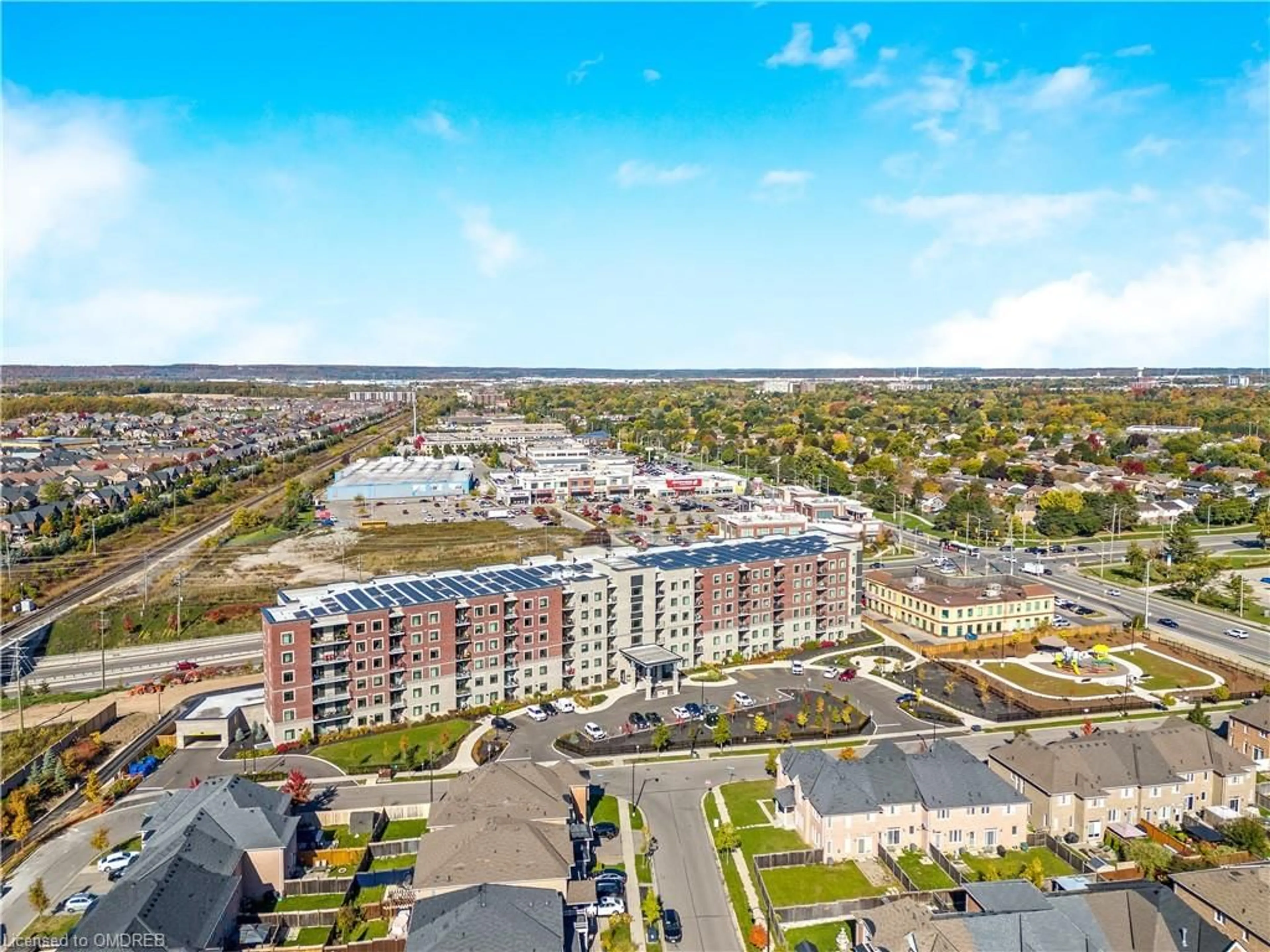 A pic from exterior of the house or condo, the view of city buildings for 830 Megson Terr #119, Milton Ontario L9T 9M7