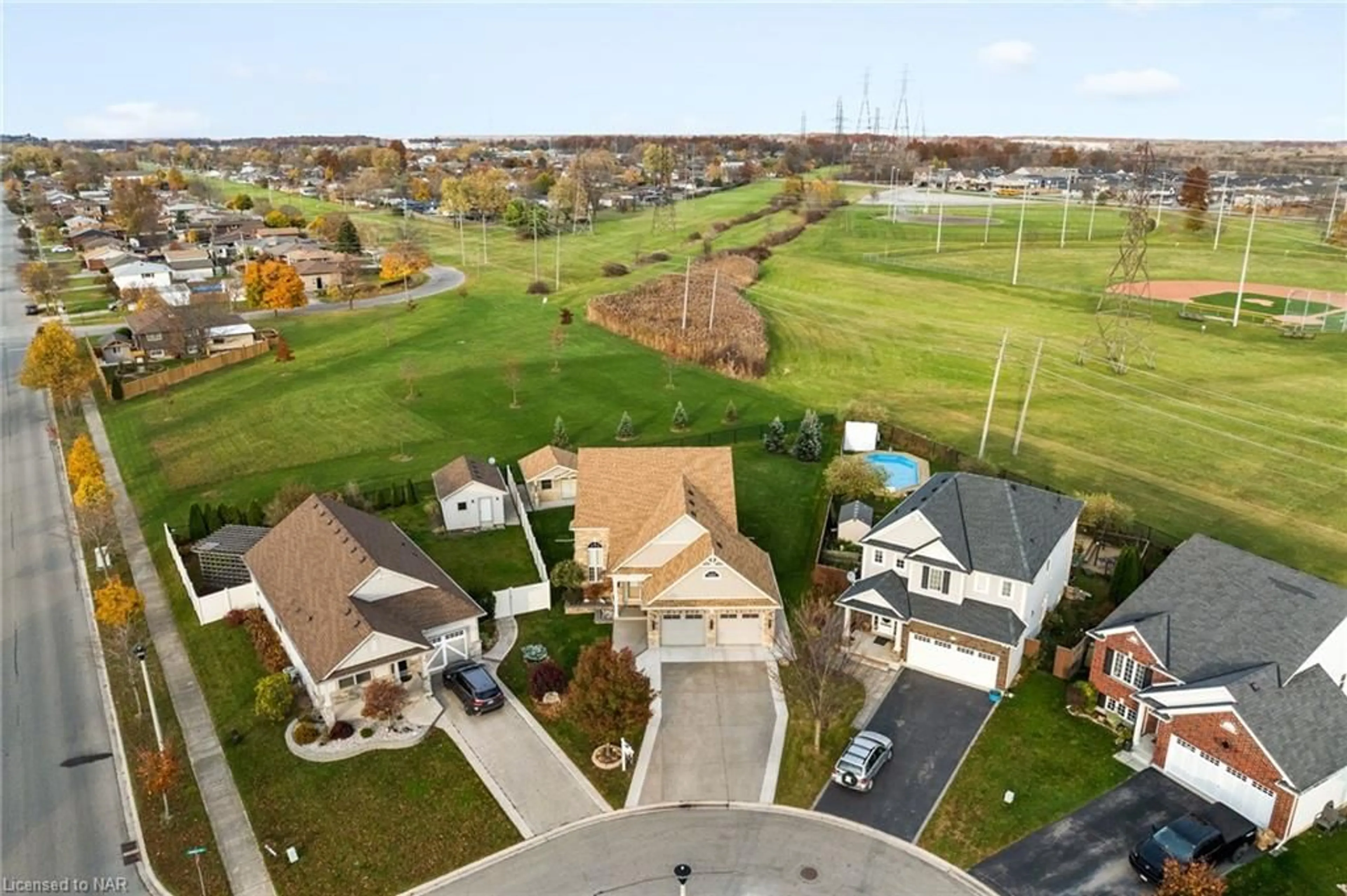 A pic from exterior of the house or condo, the fenced backyard for 15 Auburn Crt, Welland Ontario L3B 0A5