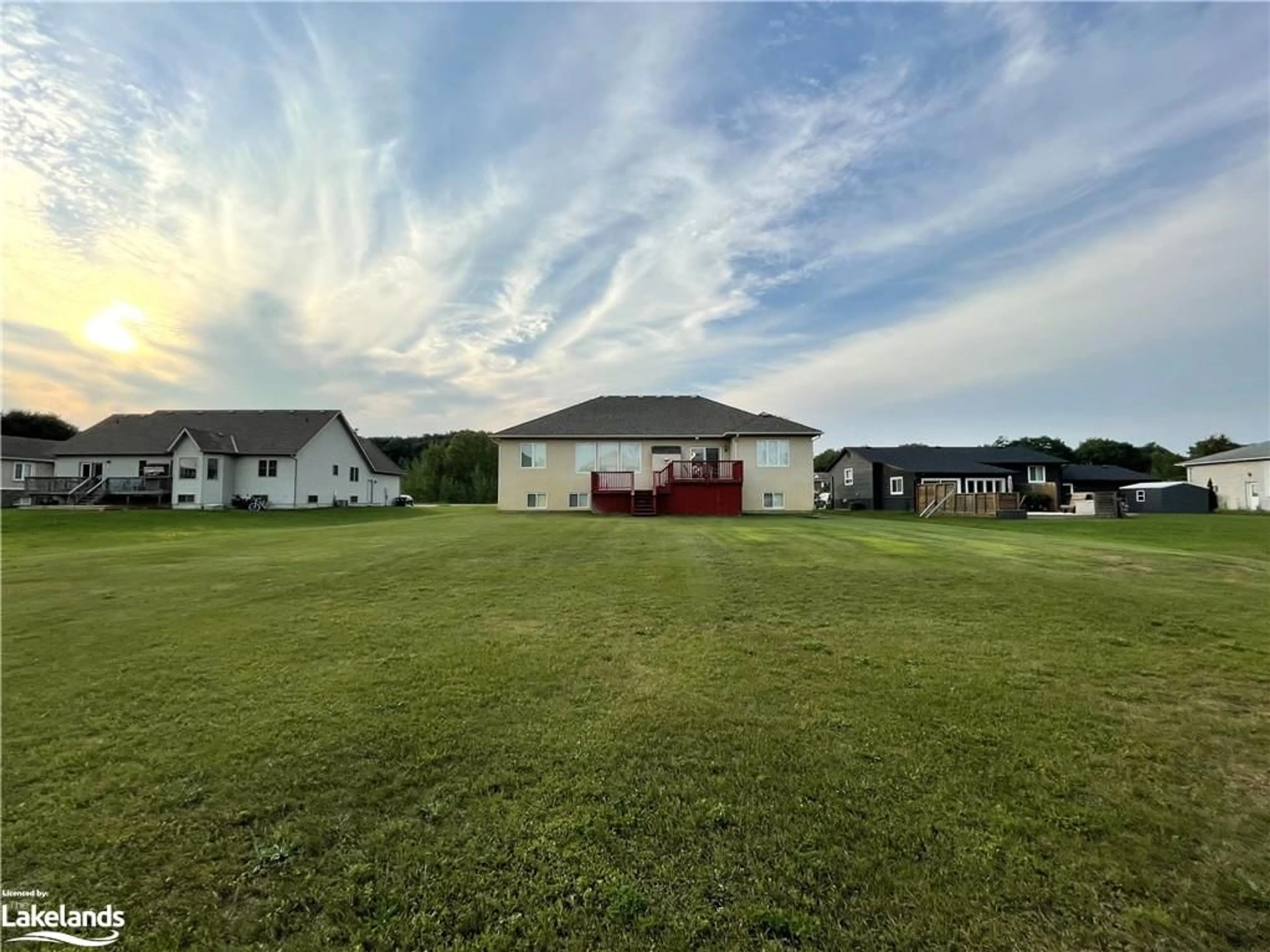 Frontside or backside of a home, the fenced backyard for 16 Wasaga Sands Dr, Wasaga Beach Ontario L9Z 1J6