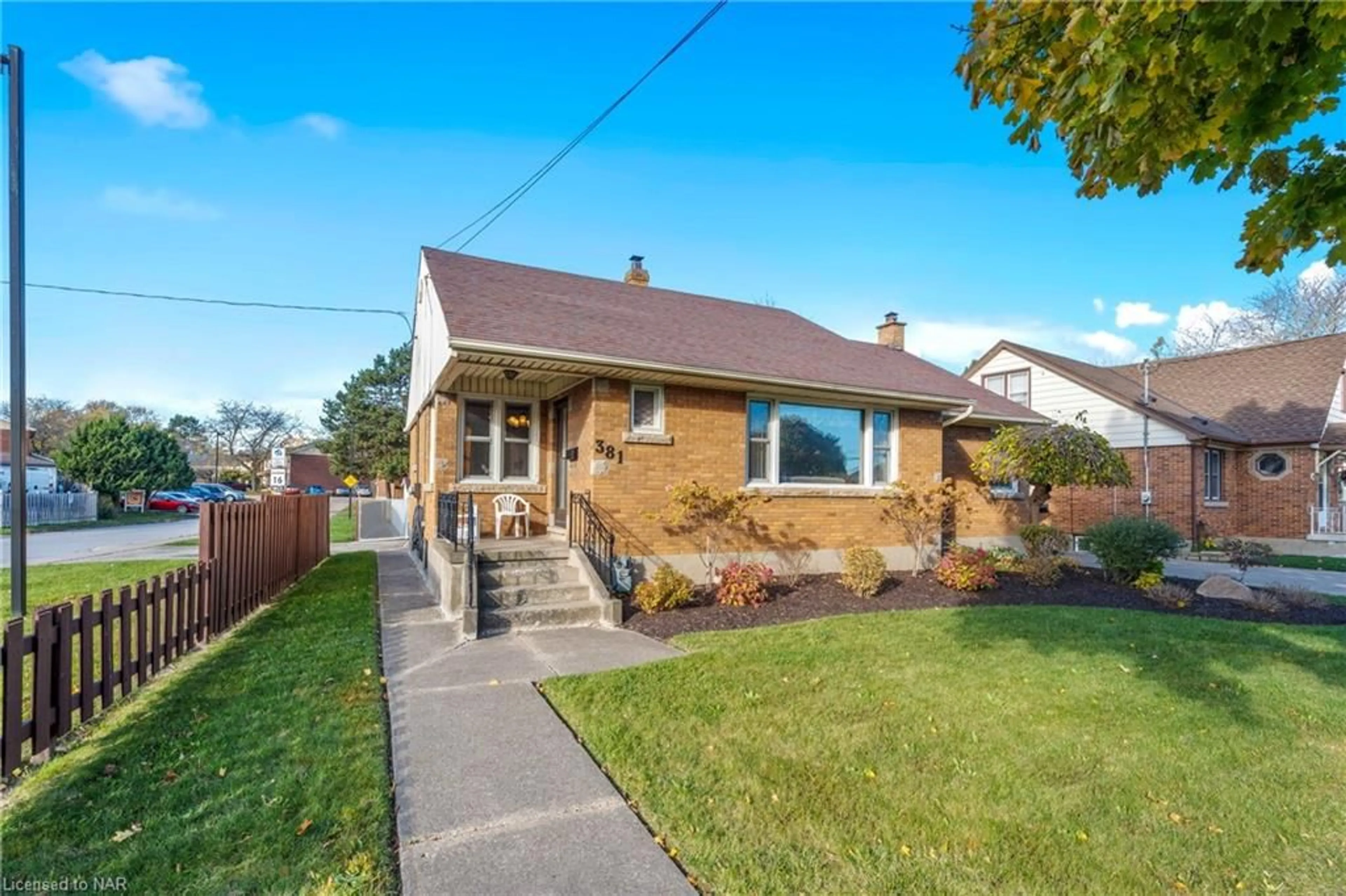 Frontside or backside of a home, the fenced backyard for 381 Niagara St, St. Catharines Ontario L2M 4V9