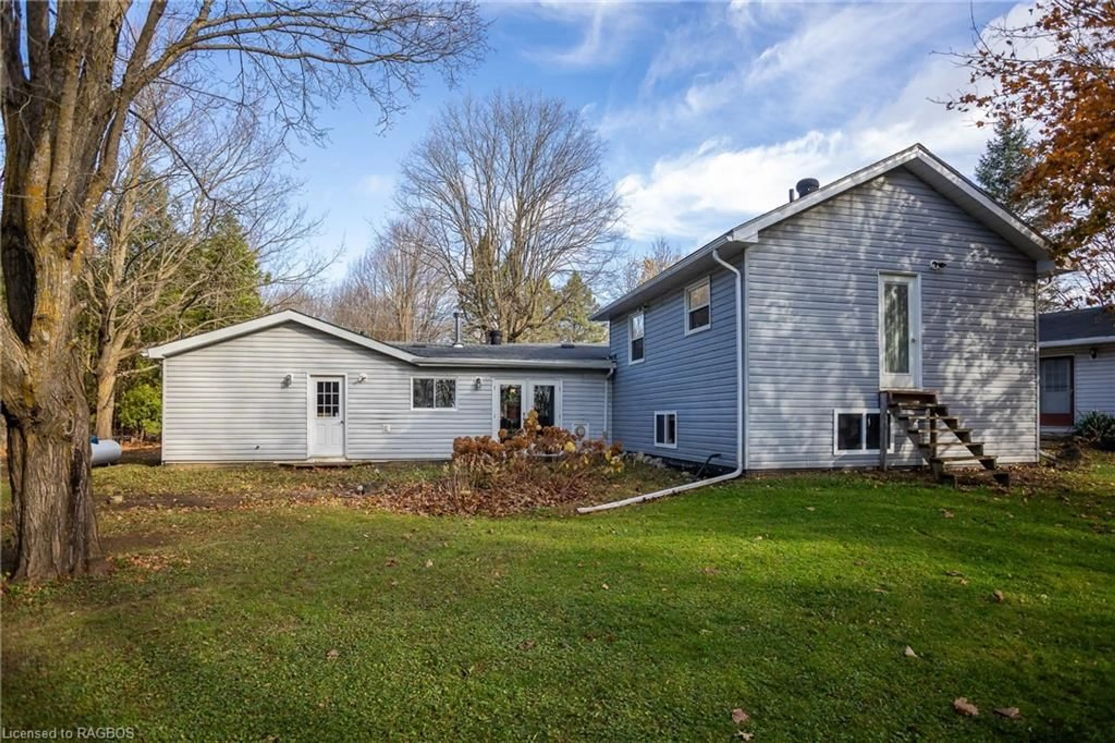 Frontside or backside of a home, the fenced backyard for 202 North St, Grey Highlands Ontario N0C 1E0