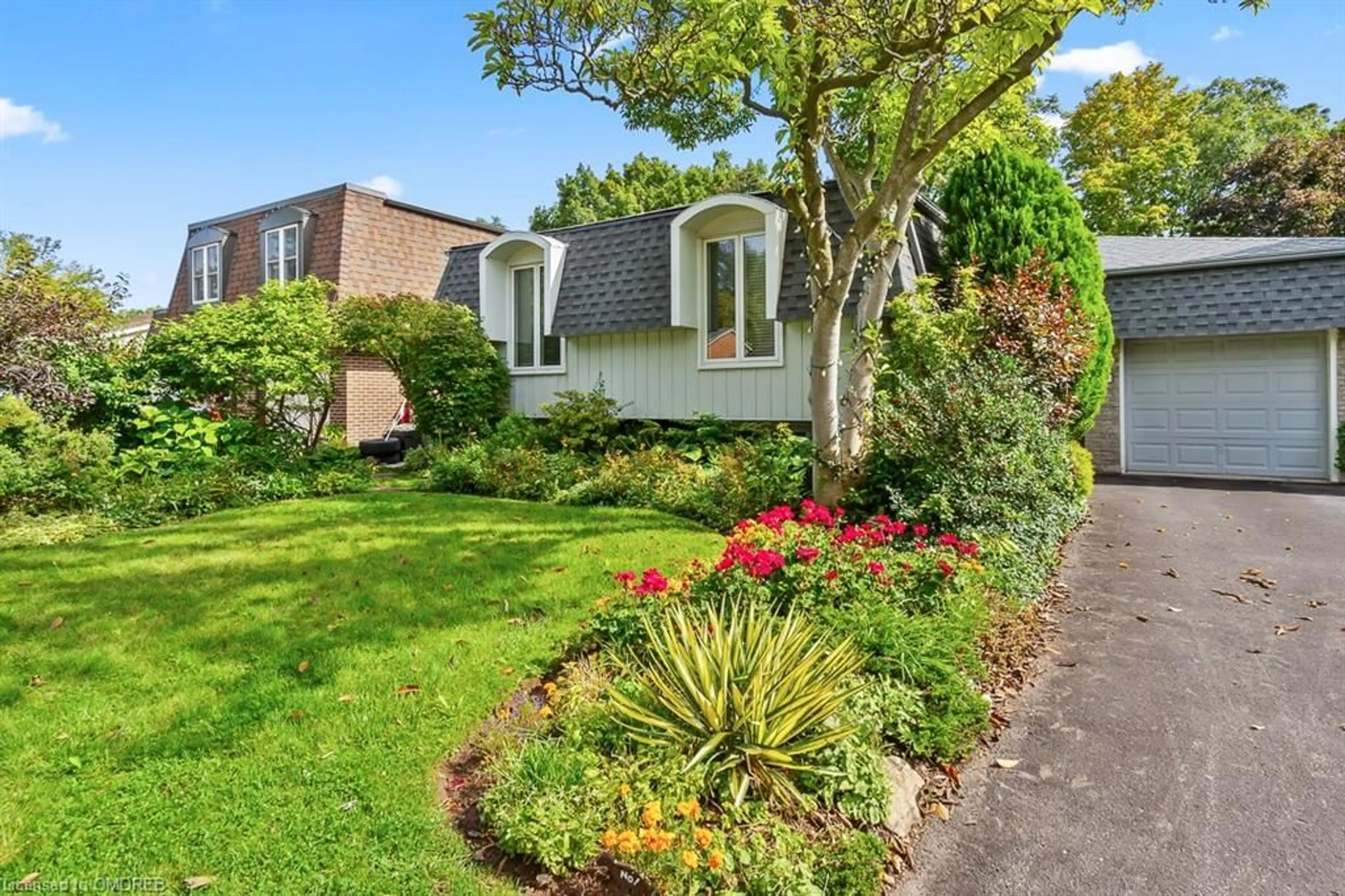 A pic from exterior of the house or condo, the fenced backyard for 1180 Falgarwood Dr, Oakville Ontario L6H 2L3