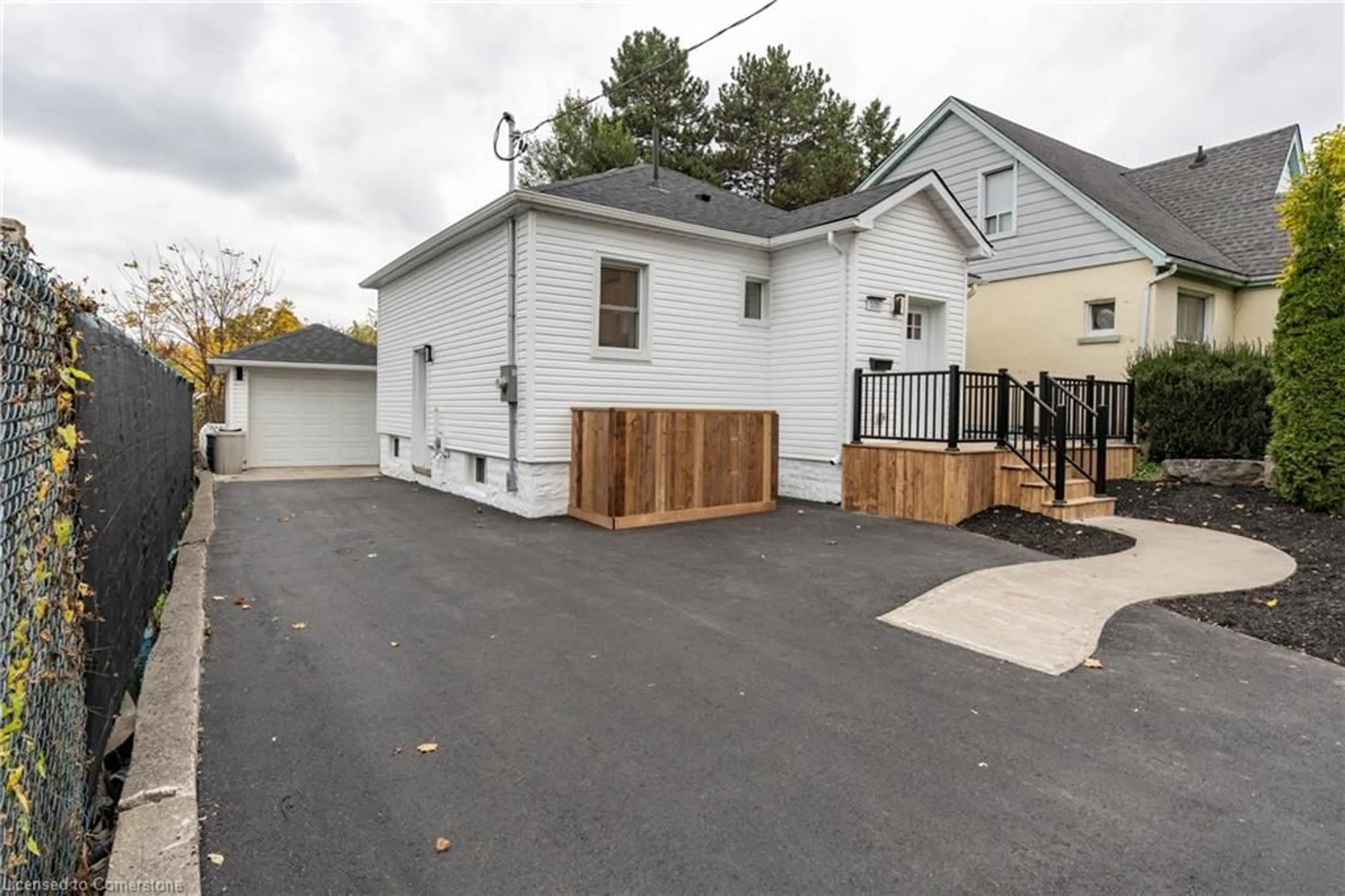 Frontside or backside of a home, the fenced backyard for 105 Lancaster St, Kitchener Ontario N2H 4T4