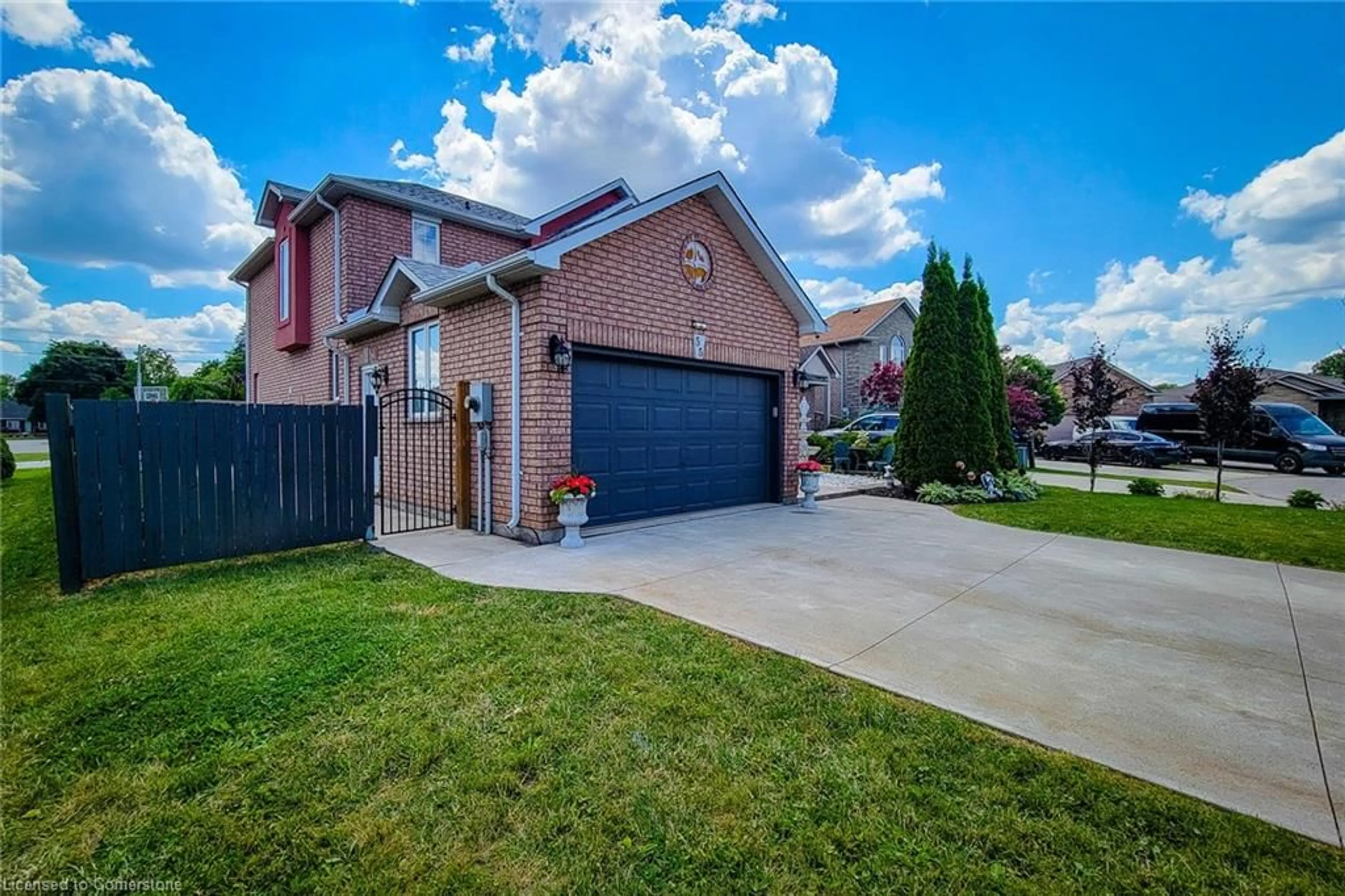 Frontside or backside of a home, the fenced backyard for 55 Alexsia Crt, Hamilton Ontario L9B 2T3