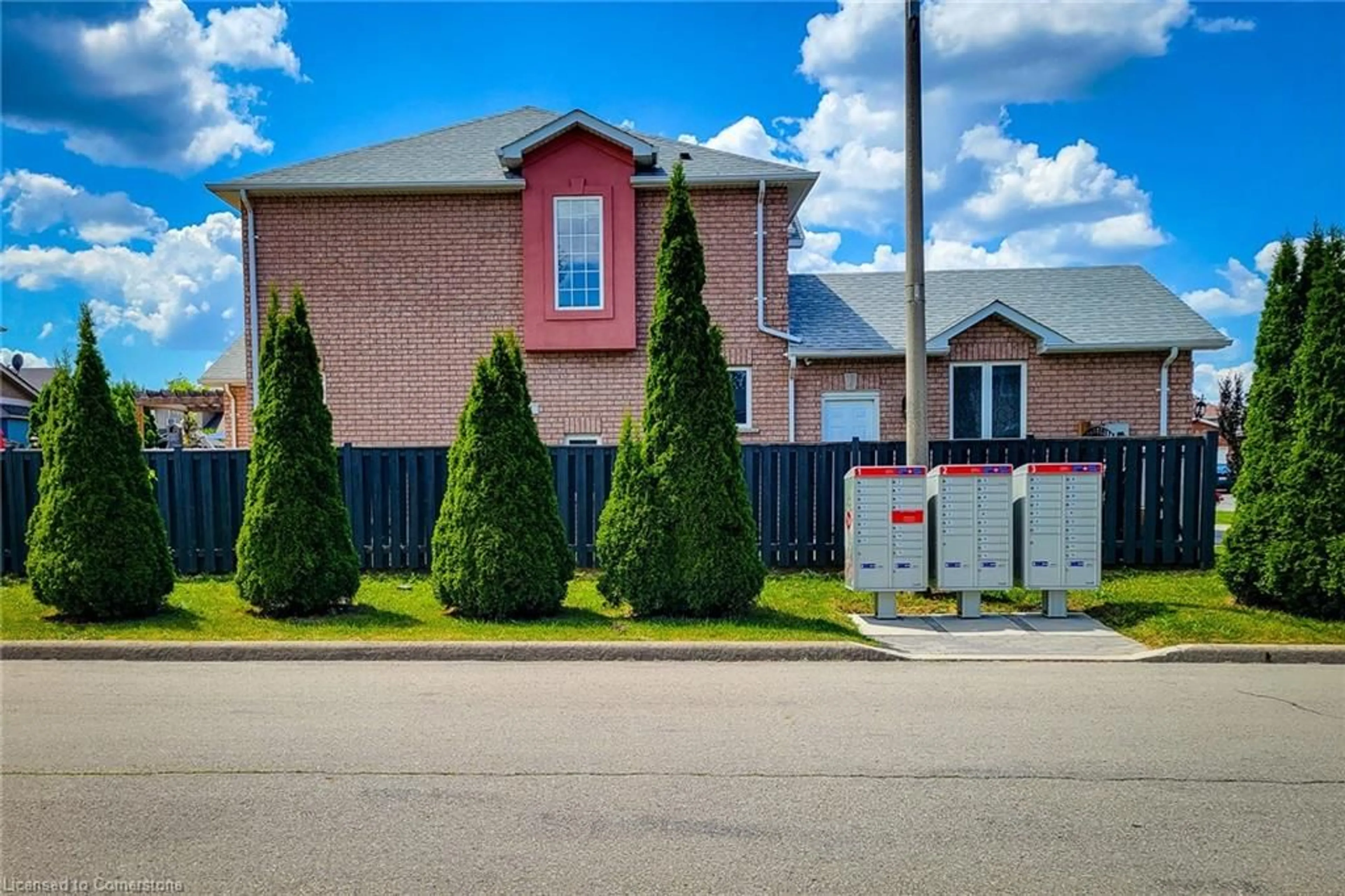 Frontside or backside of a home, the fenced backyard for 55 Alexsia Crt, Hamilton Ontario L9B 2T3