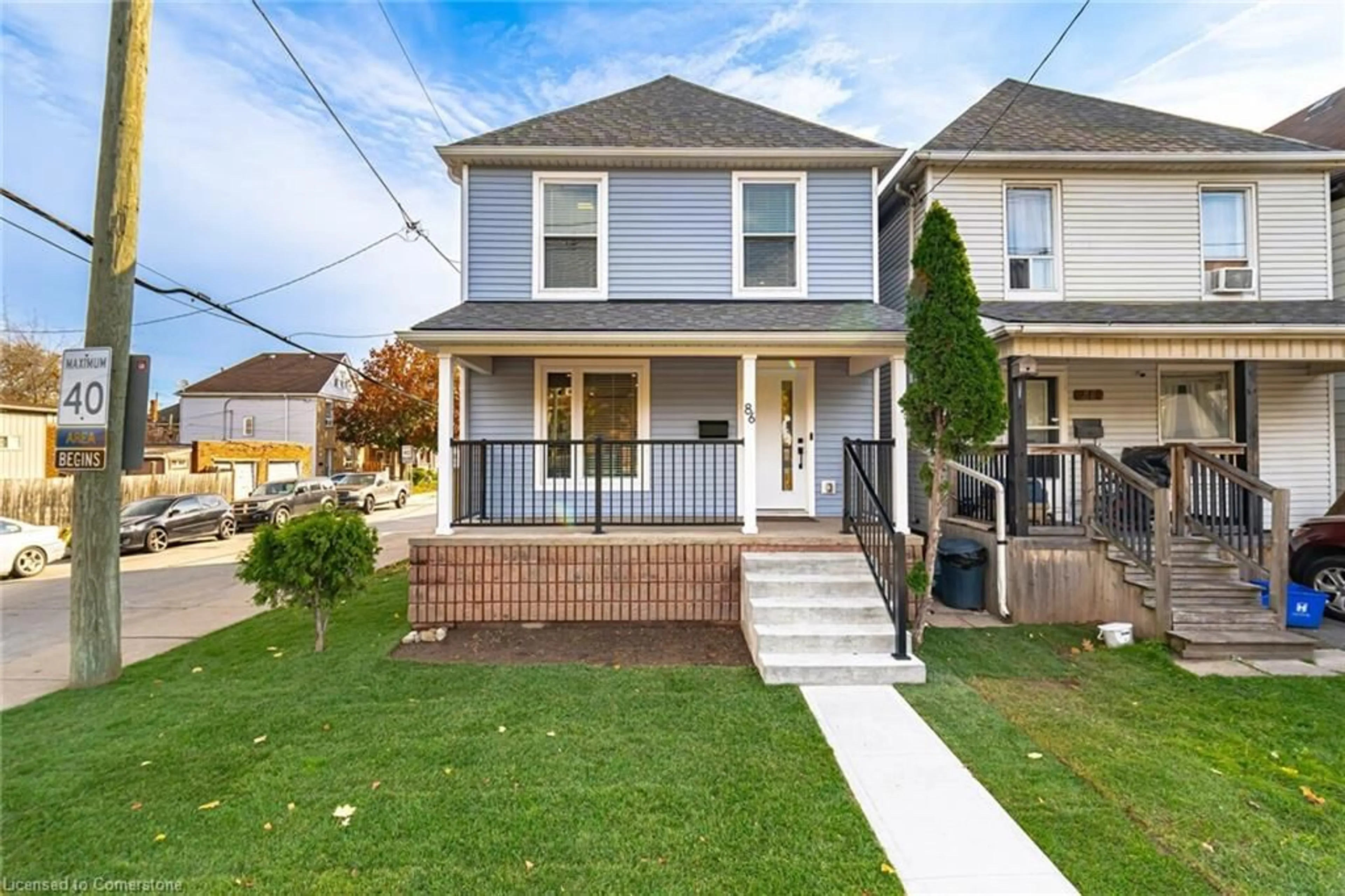 Frontside or backside of a home, the fenced backyard for 86 Gage Ave, Hamilton Ontario L8L 7A1