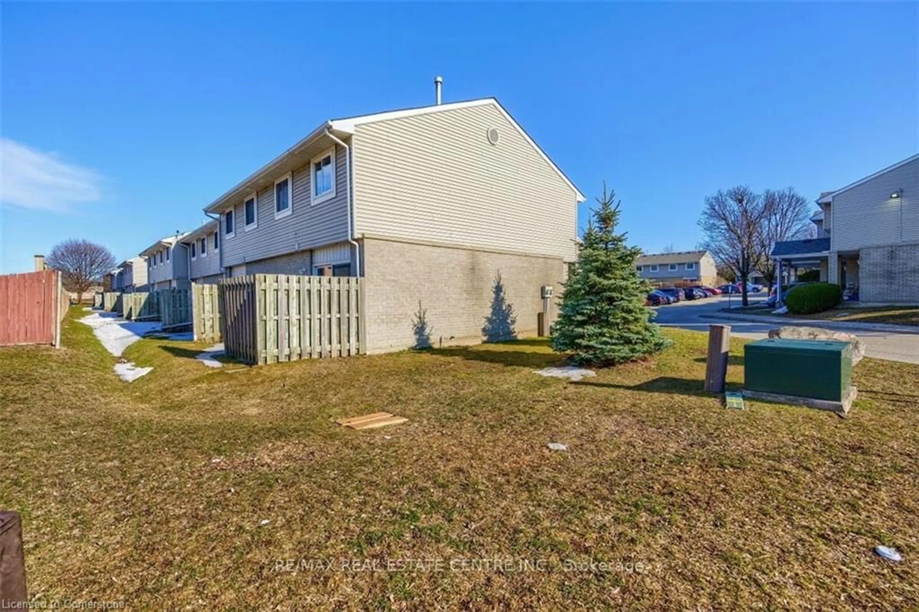 A pic from exterior of the house or condo, the fenced backyard for 125 Sekura Cres #1, Waterloo Ontario N1R 8B4