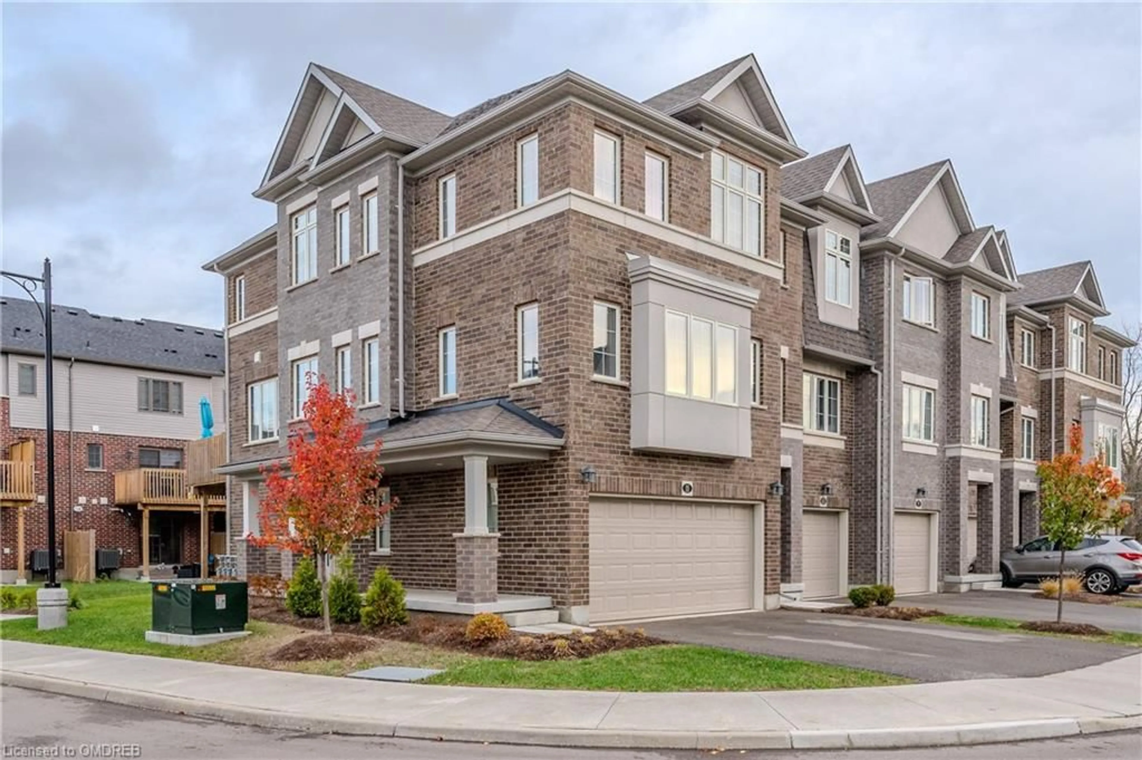 A pic from exterior of the house or condo, the street view for 311 Woolwich St #11, Waterloo Ontario N2K 0H4