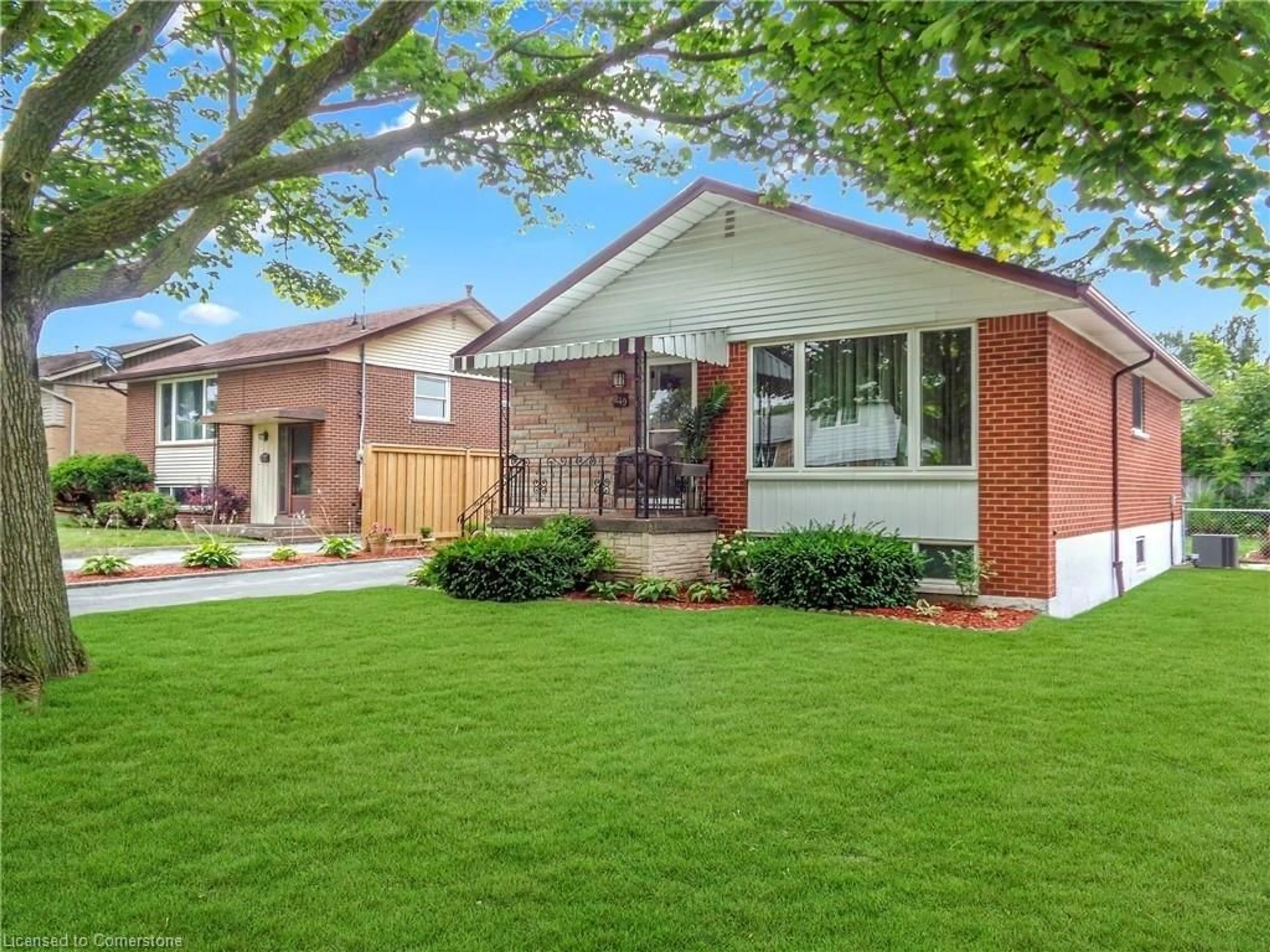 Frontside or backside of a home, the fenced backyard for 249 Fernwood Cres, Hamilton Ontario L8T 3L7