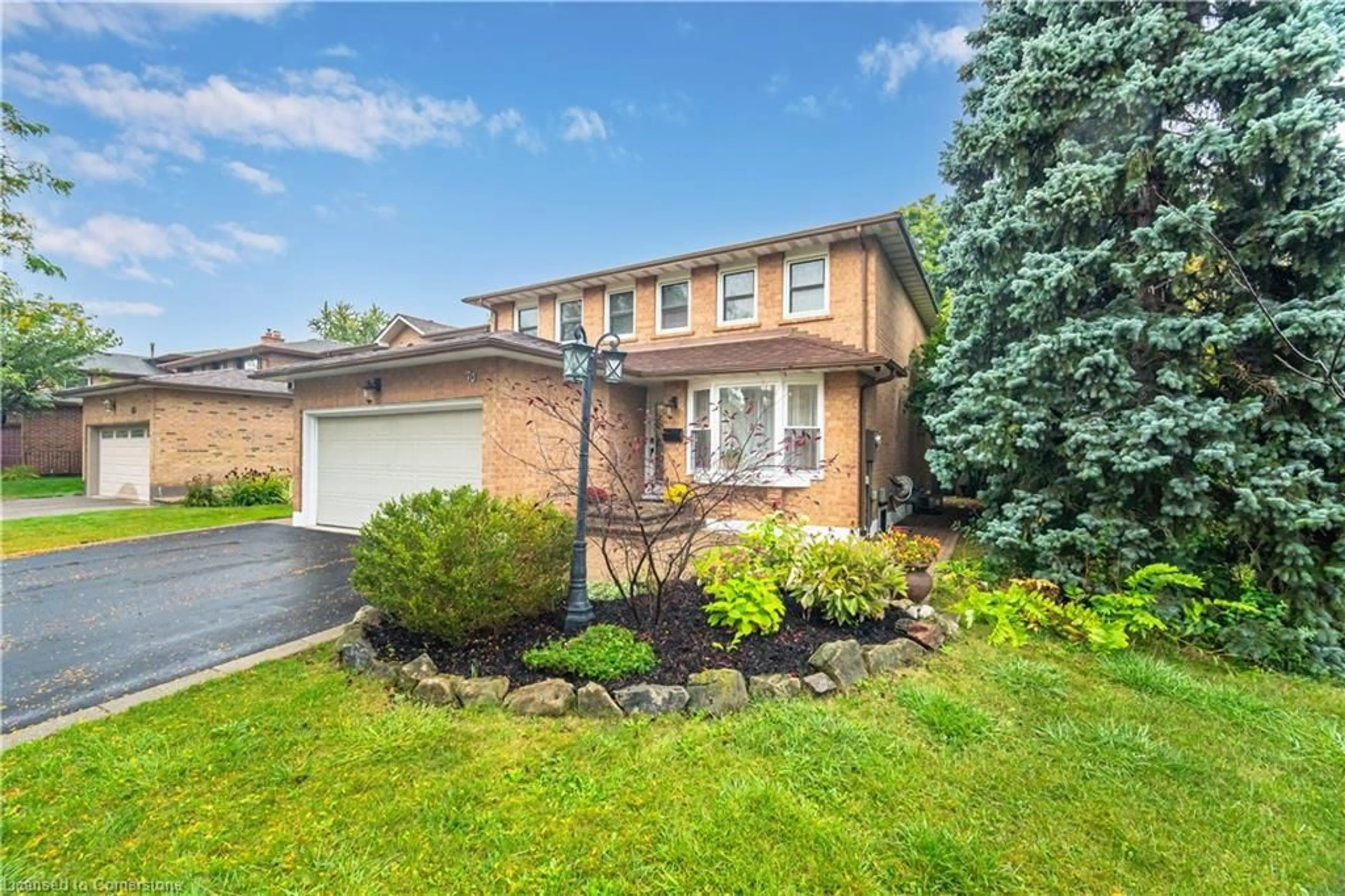 Frontside or backside of a home, the fenced backyard for 70 Lakecrest Trail, Brampton Ontario L6Z 1S6