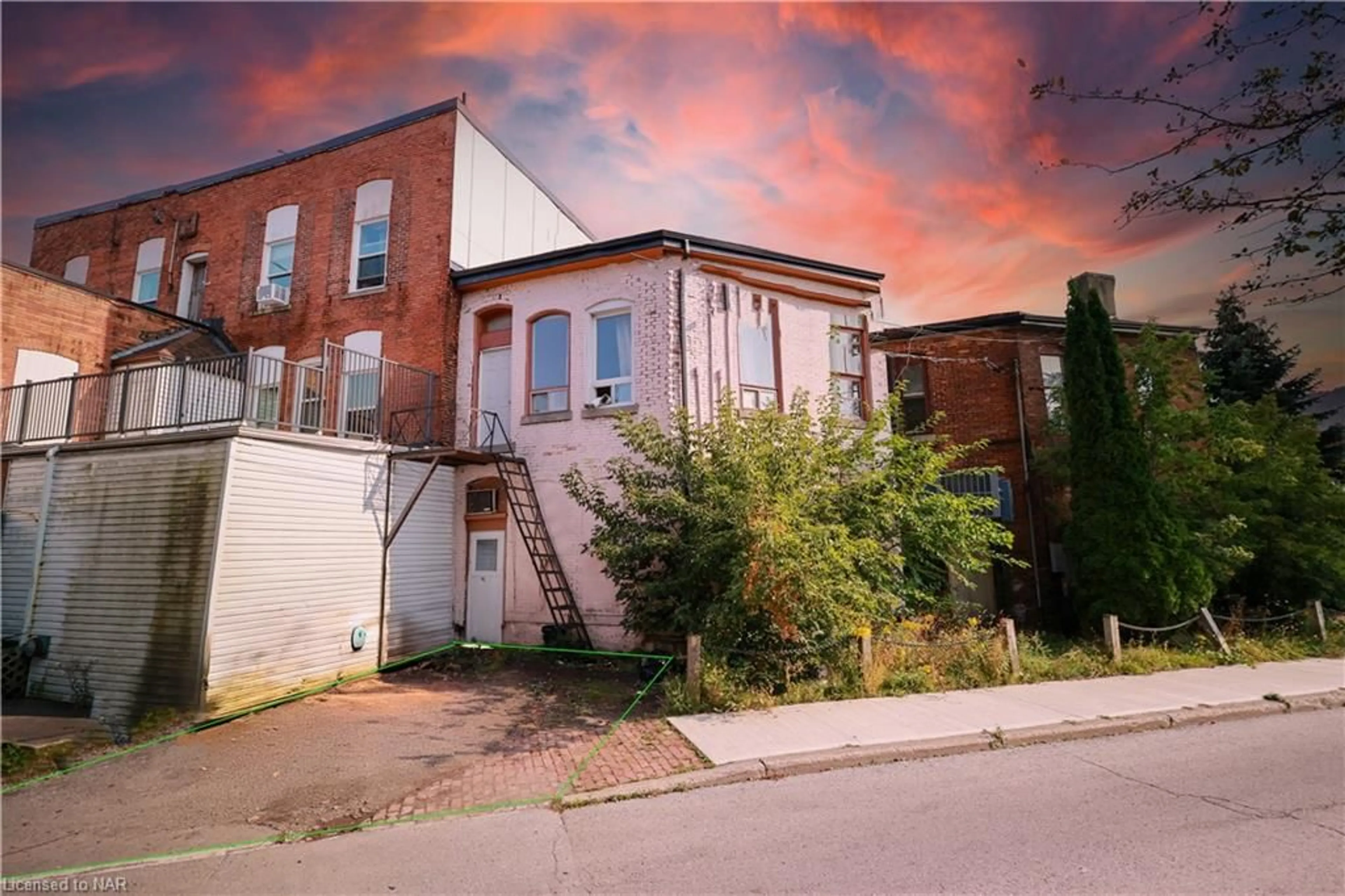 Frontside or backside of a home, the street view for 12 East Main St, Welland Ontario L3B 3W3