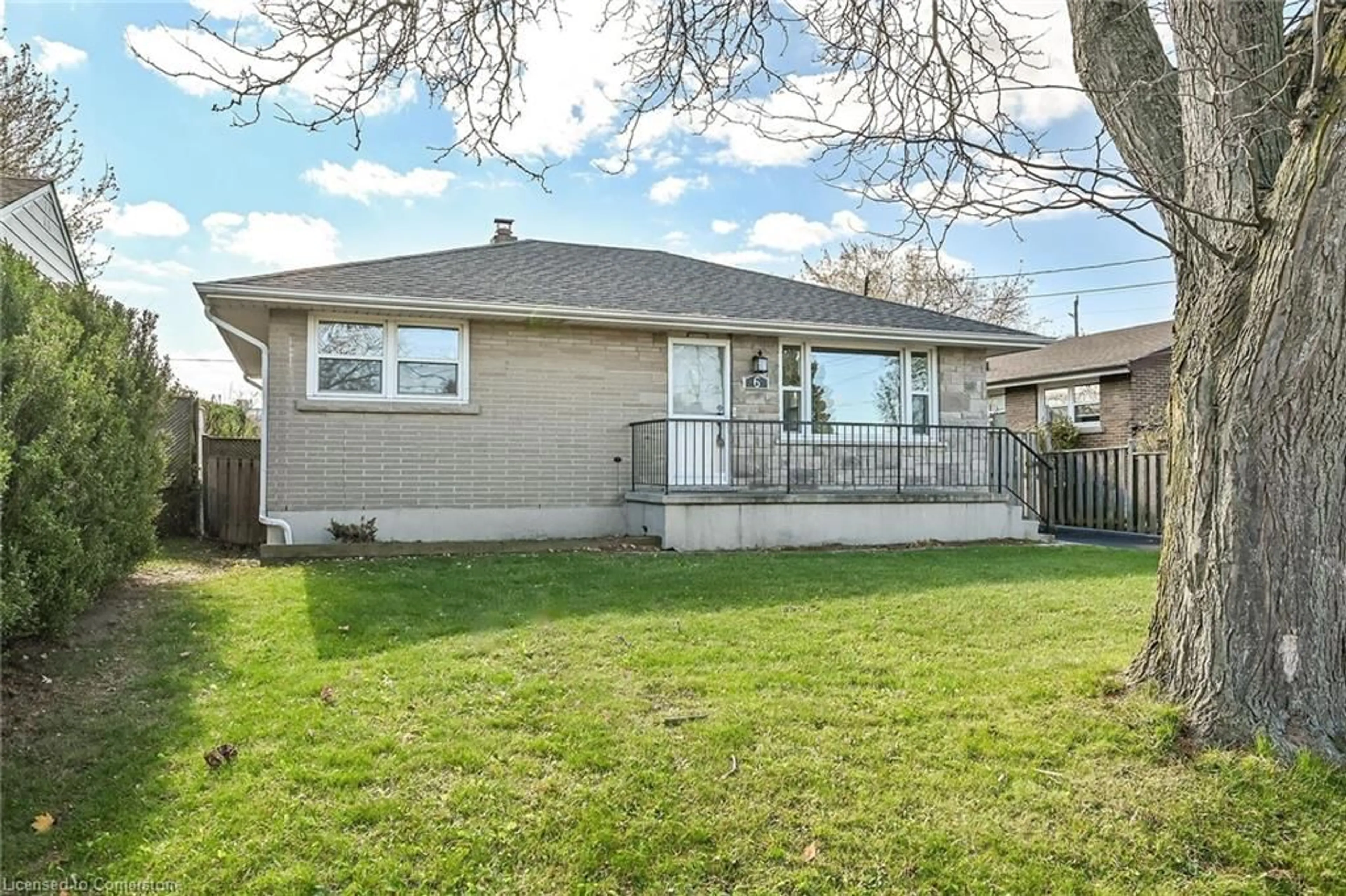 Frontside or backside of a home, the fenced backyard for 6 Grandfield St, Hamilton Ontario L8T 2H2