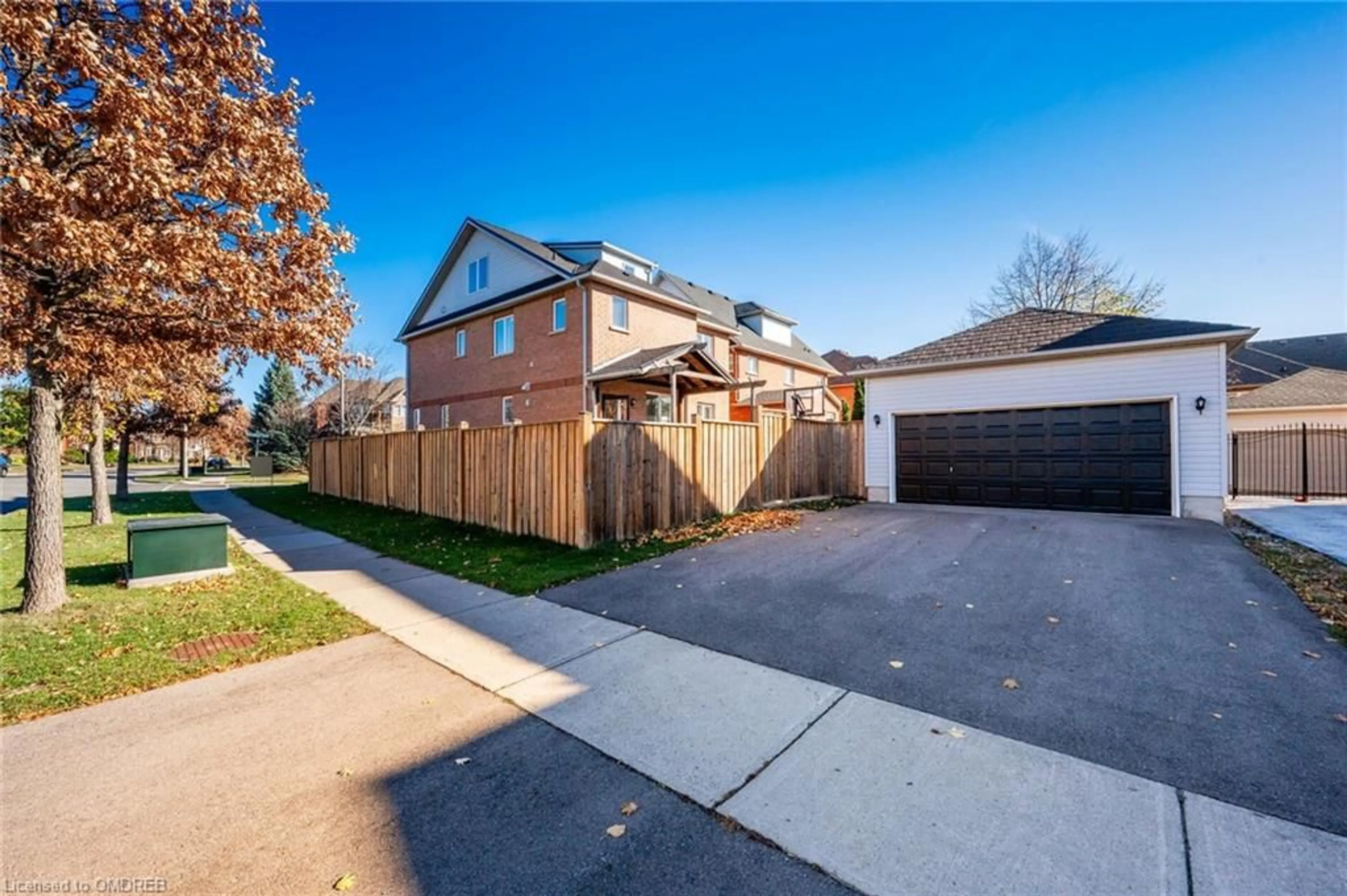 Frontside or backside of a home, the fenced backyard for 2540 Sunnyhurst Close, Oakville Ontario L6H 7K5