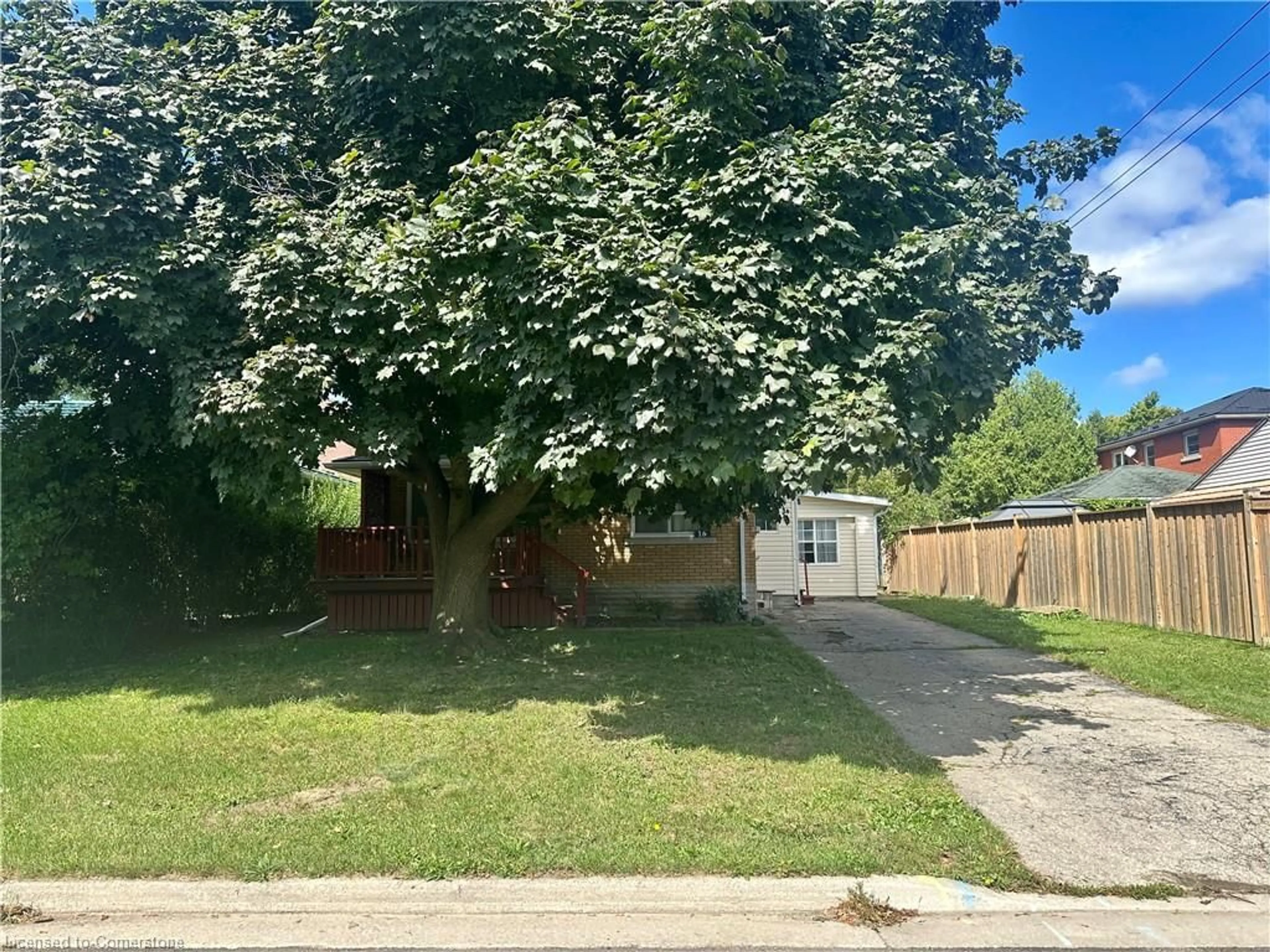 Frontside or backside of a home, the fenced backyard for 15 Cornell Ave, Kitchener Ontario N2G 3E5