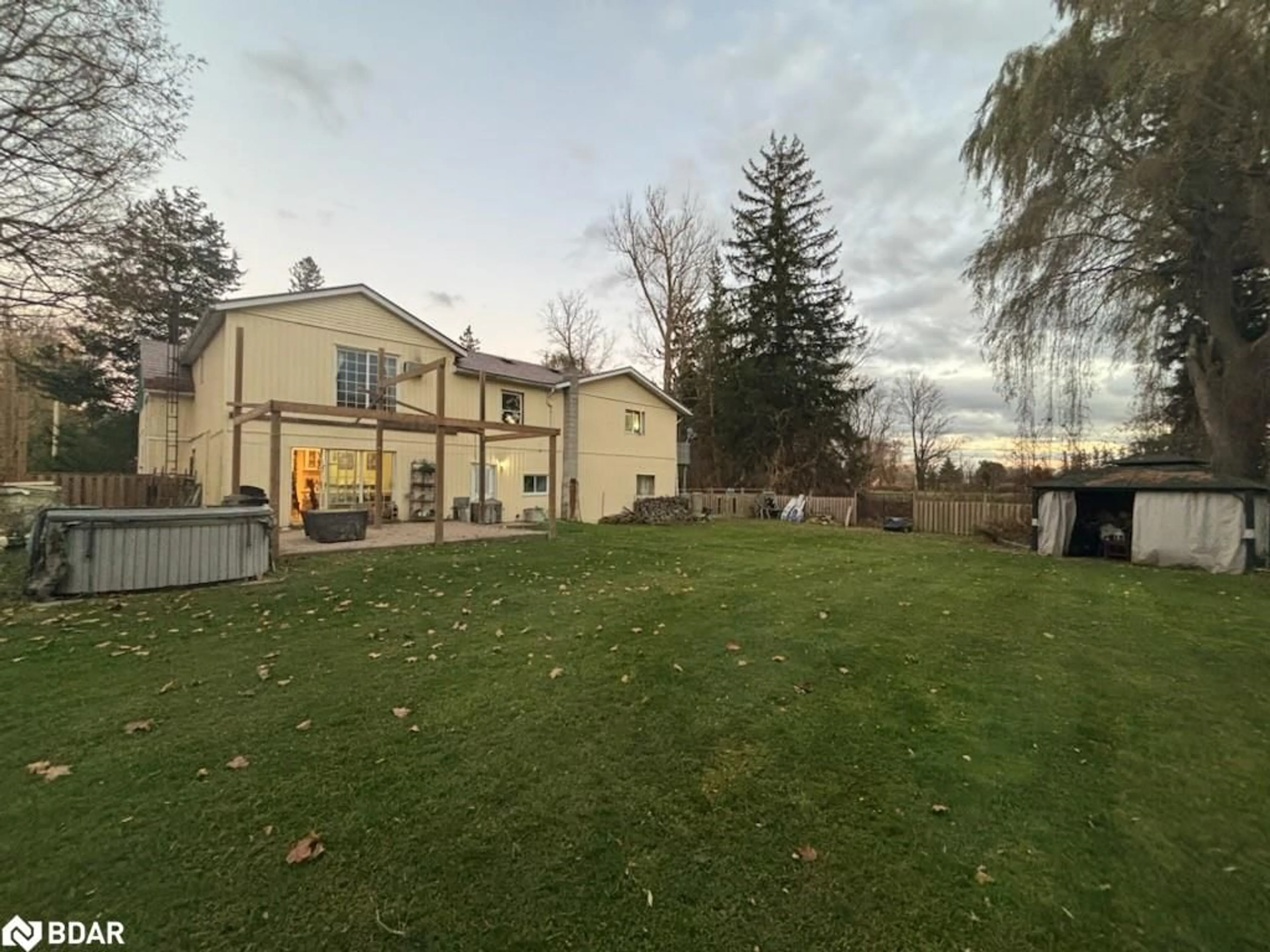 Frontside or backside of a home, the fenced backyard for 8384 6th Line Line, Utopia Ontario L0M 1T0