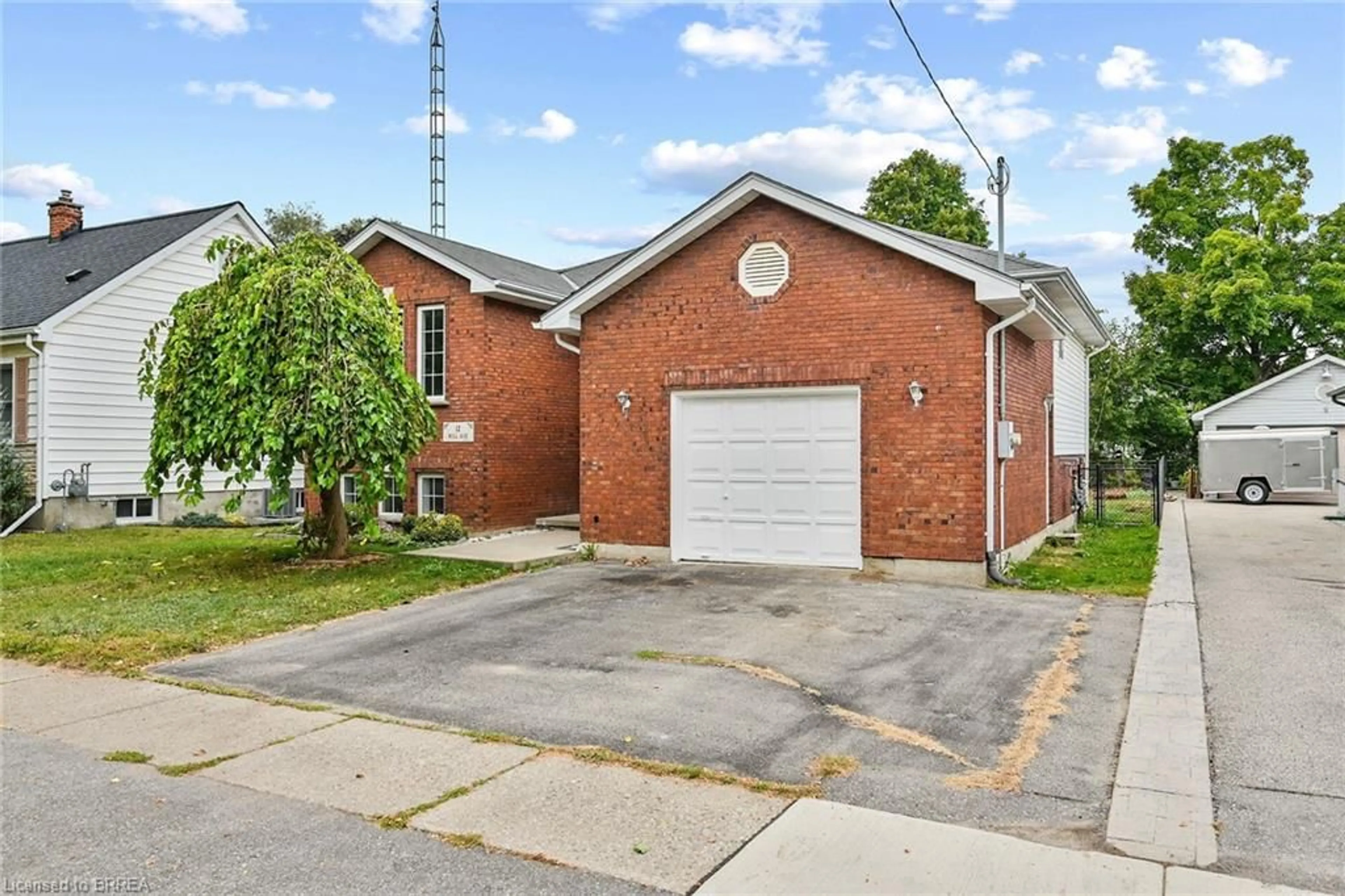 Home with brick exterior material for 12 Hill Ave, Brantford Ontario N3R 4G9