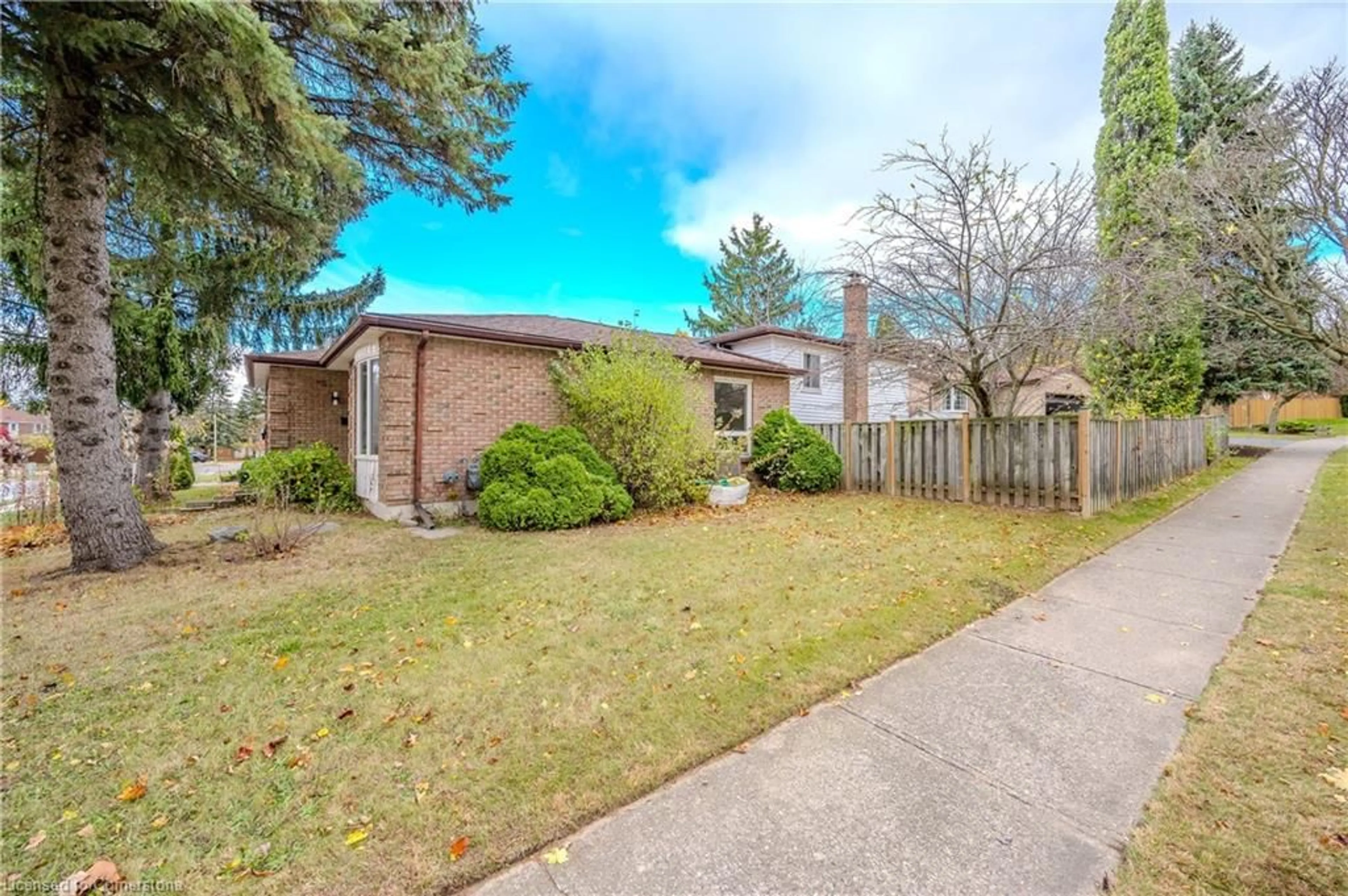 A pic from exterior of the house or condo, the fenced backyard for 180 Westvale Dr, Waterloo Ontario N2T 1C2