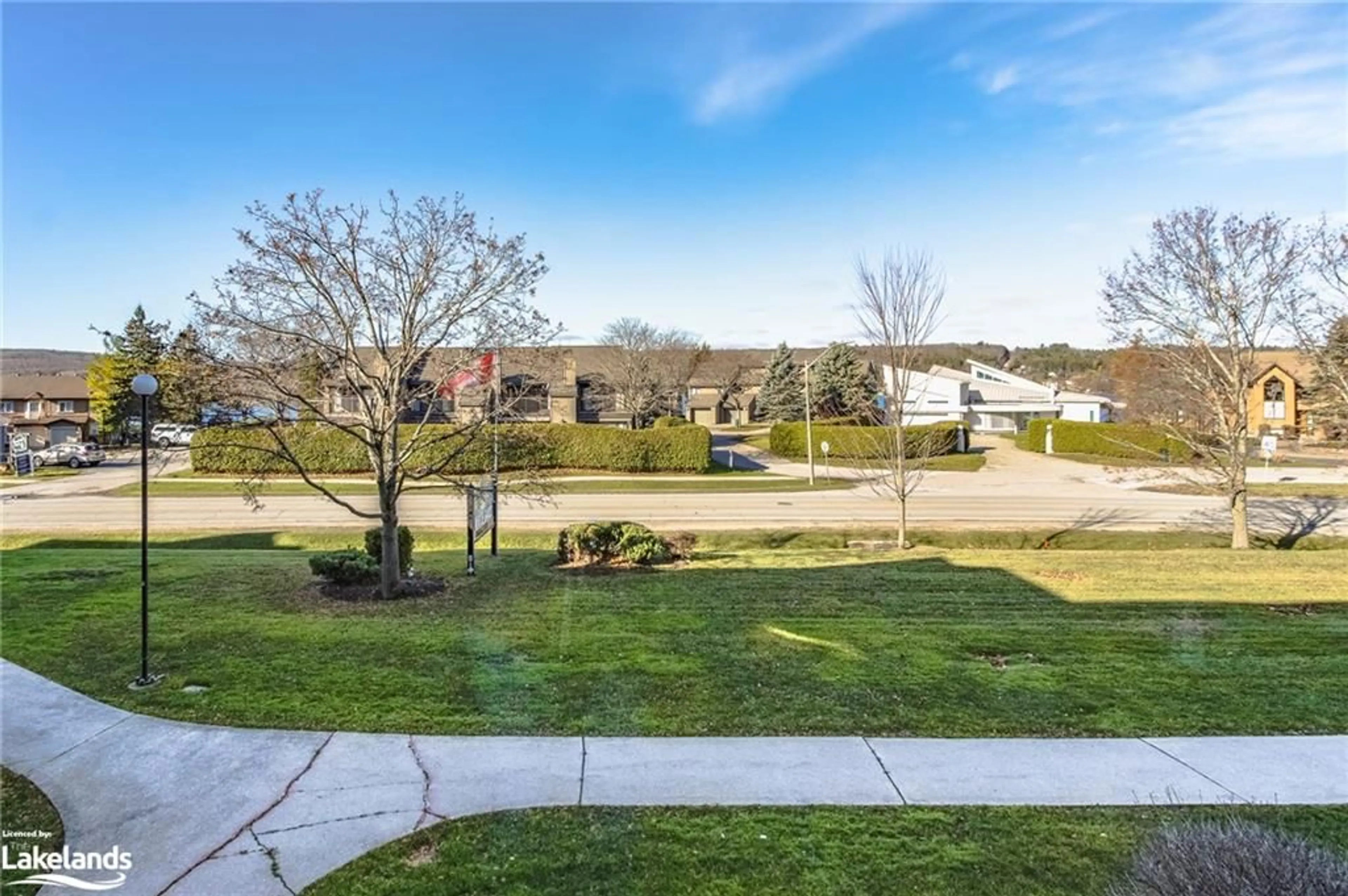 A pic from exterior of the house or condo, the fenced backyard for 11 Beck Blvd #204, Penetanguishene Ontario L9M 2G1