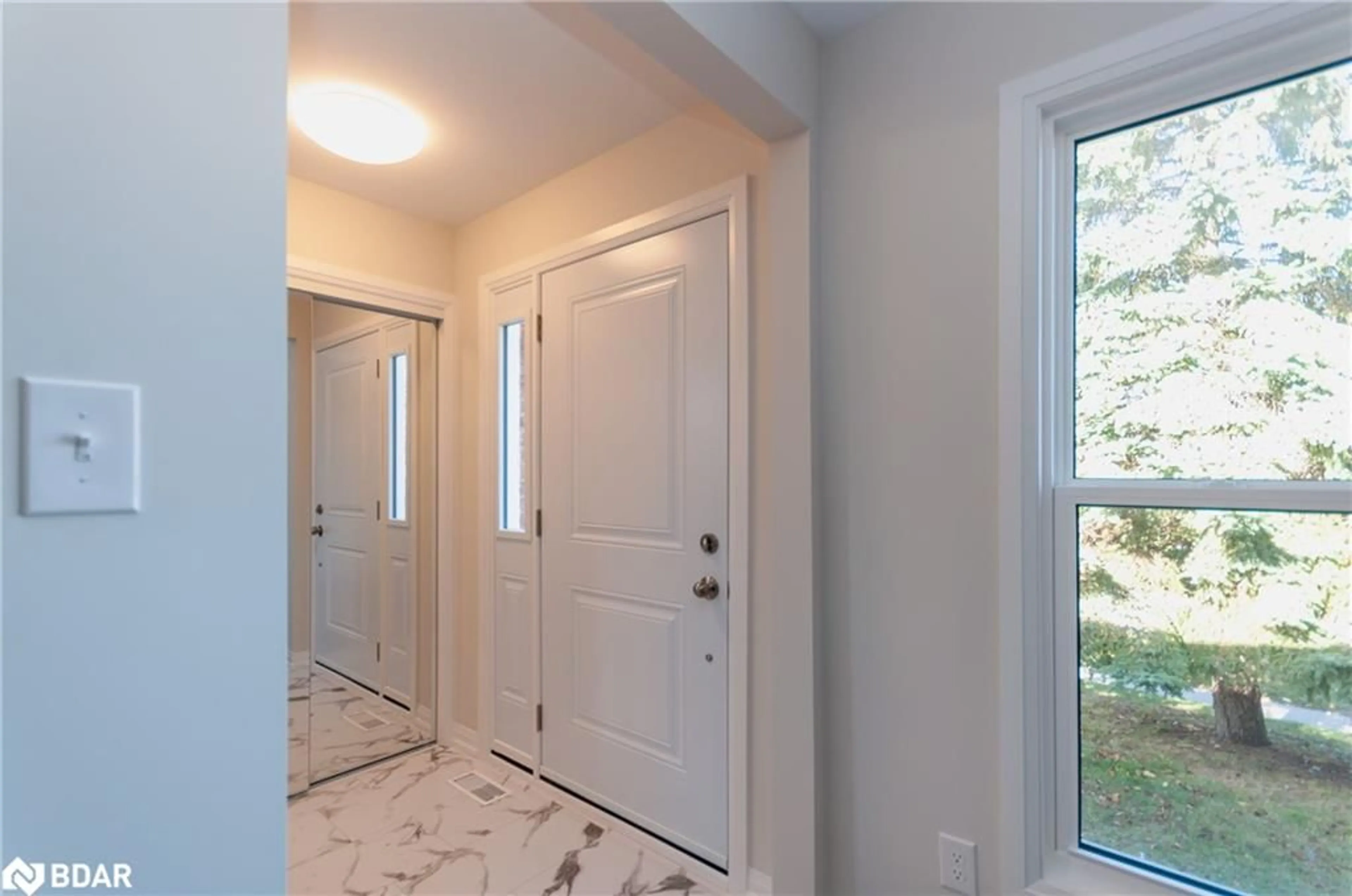 Indoor entryway, wood floors for 43 Charlbrook Ave, Barrie Ontario L4M 2Y6