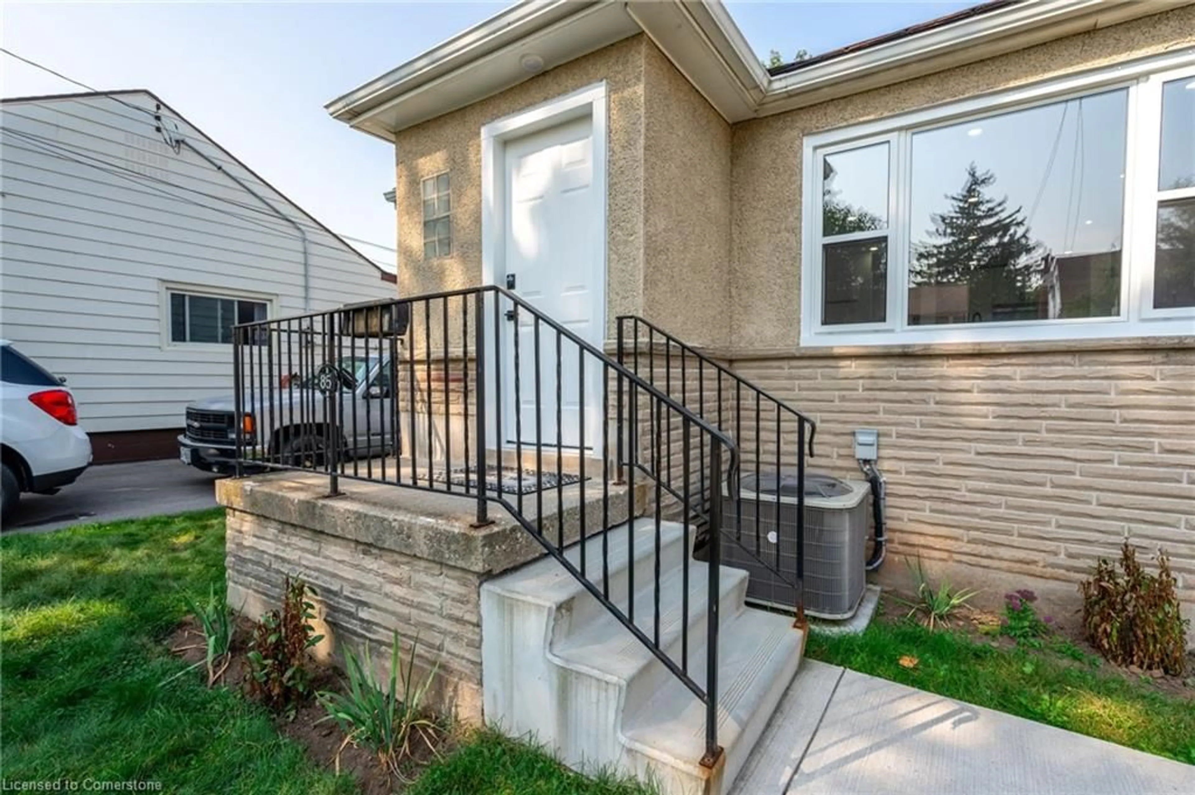 Frontside or backside of a home, the fenced backyard for 85 Walter Ave, Hamilton Ontario L8H 5P8