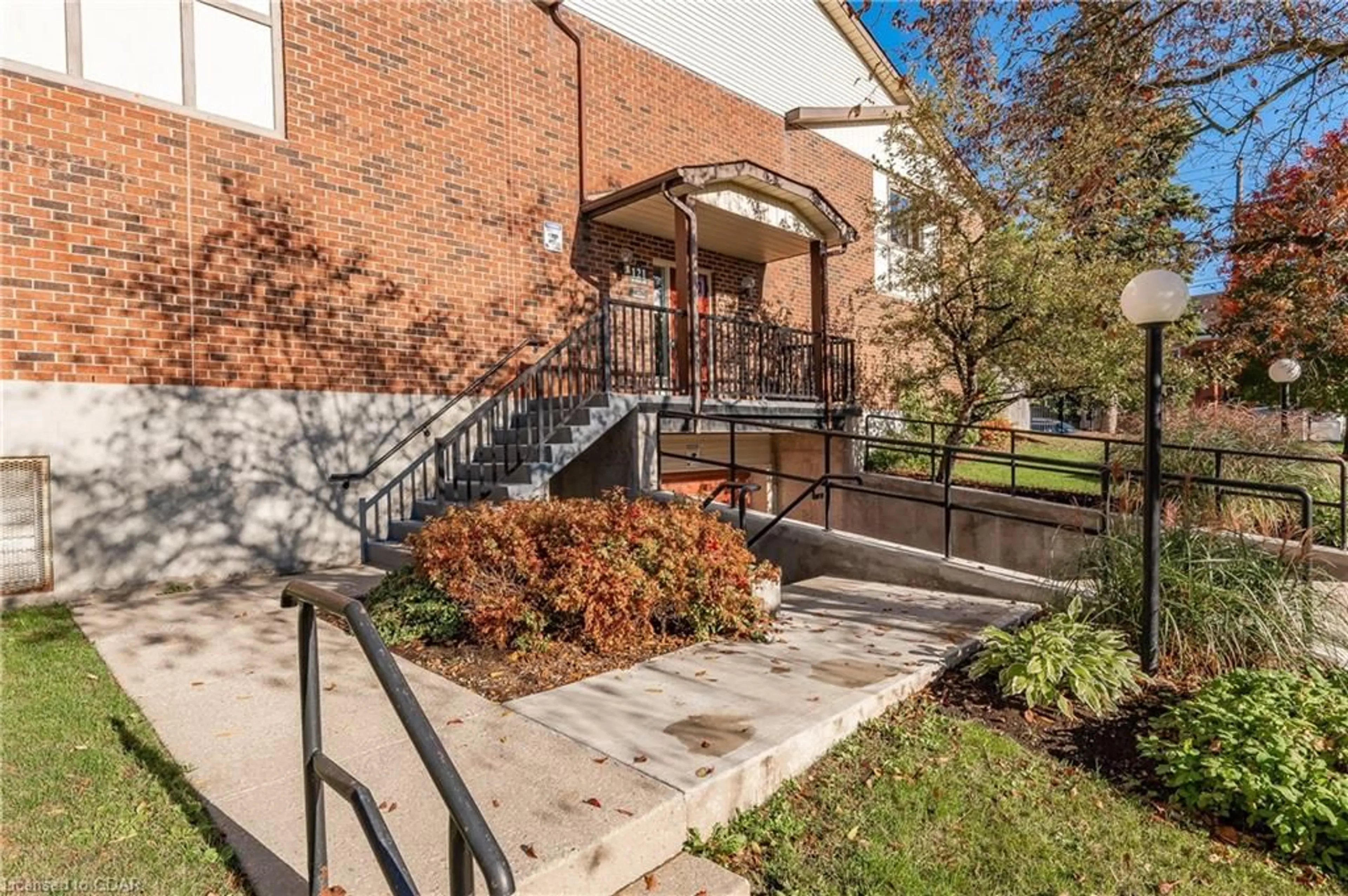 A pic from exterior of the house or condo, the front or back of building for 121 Waterloo Ave #106, Guelph Ontario N1H 3H9