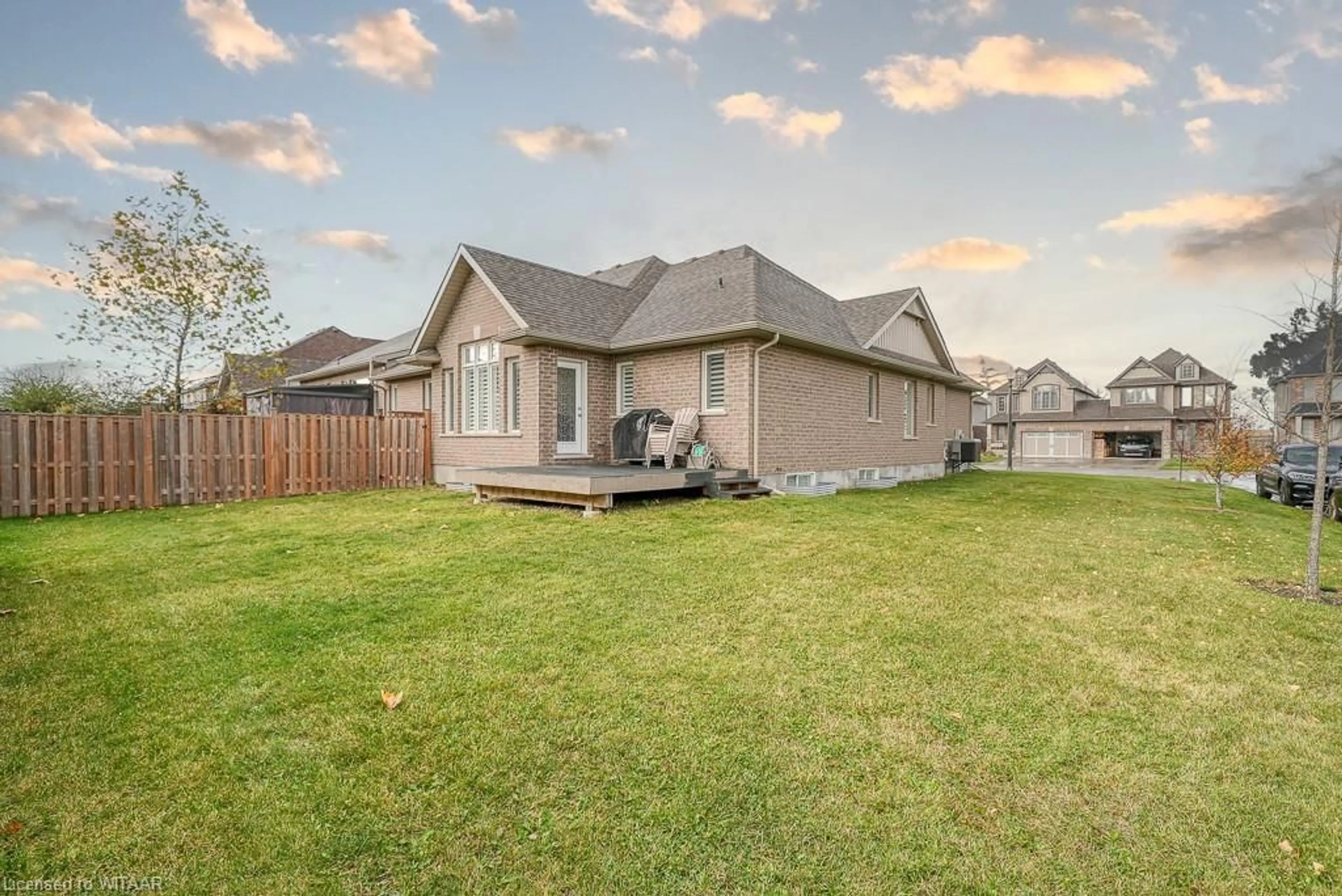 Frontside or backside of a home, the fenced backyard for 1460 Dunkirk Avenue, Woodstock Ontario N4T 0J9