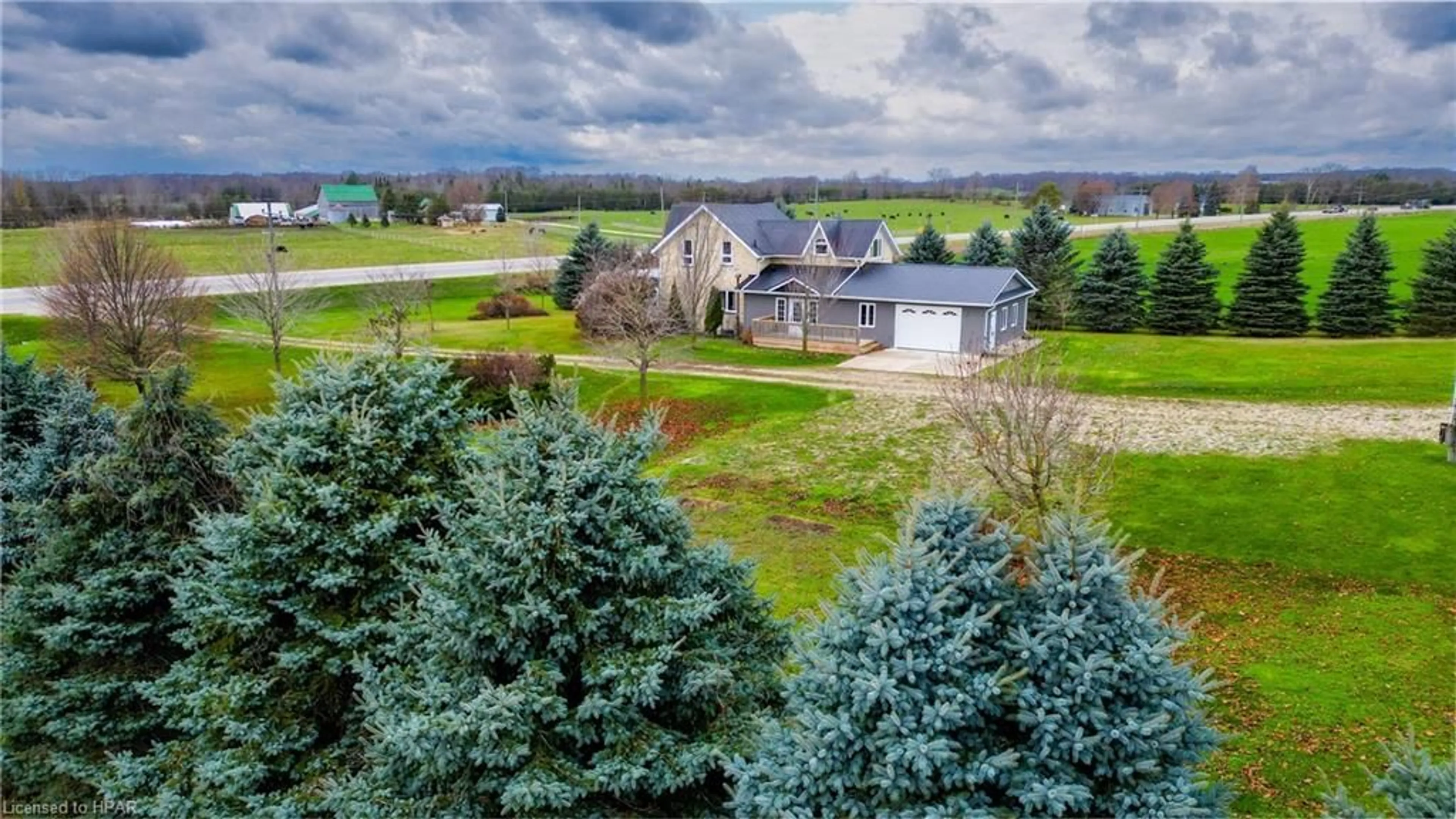 A pic from exterior of the house or condo, the fenced backyard for 311371 Hwy 6, Mount Forest Ontario N0G 2L0