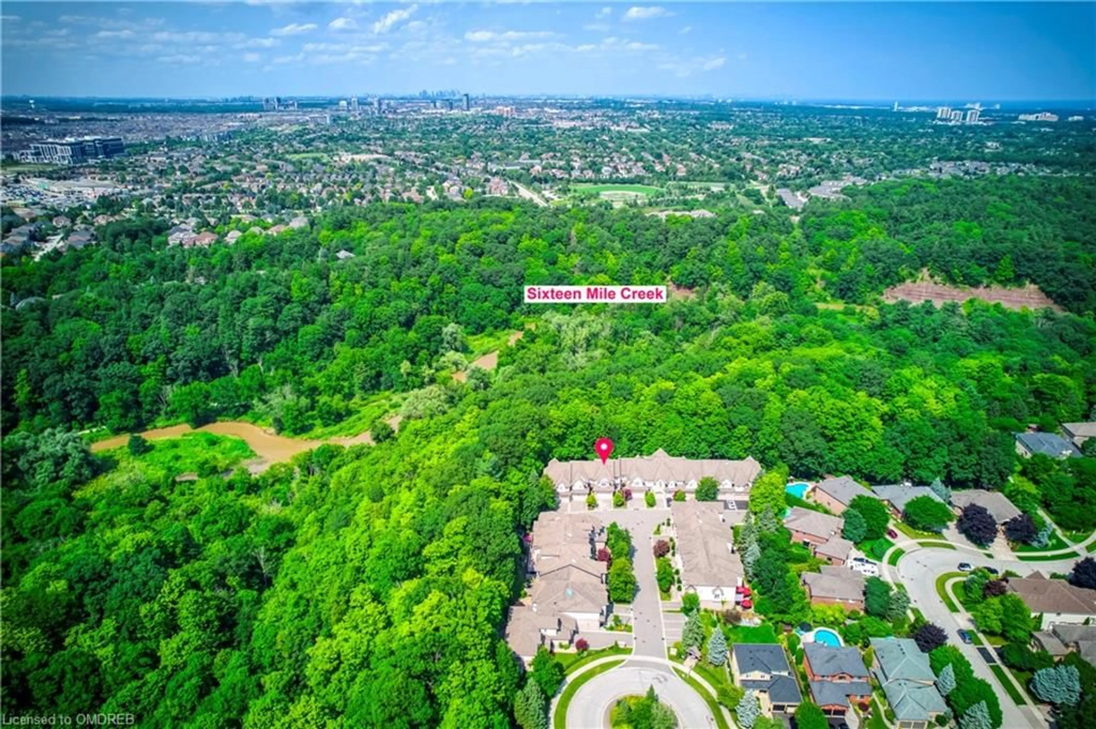 A pic from exterior of the house or condo, the fenced backyard for 2303 Hill Ridge Crt #10, Oakville Ontario L6M 3N3