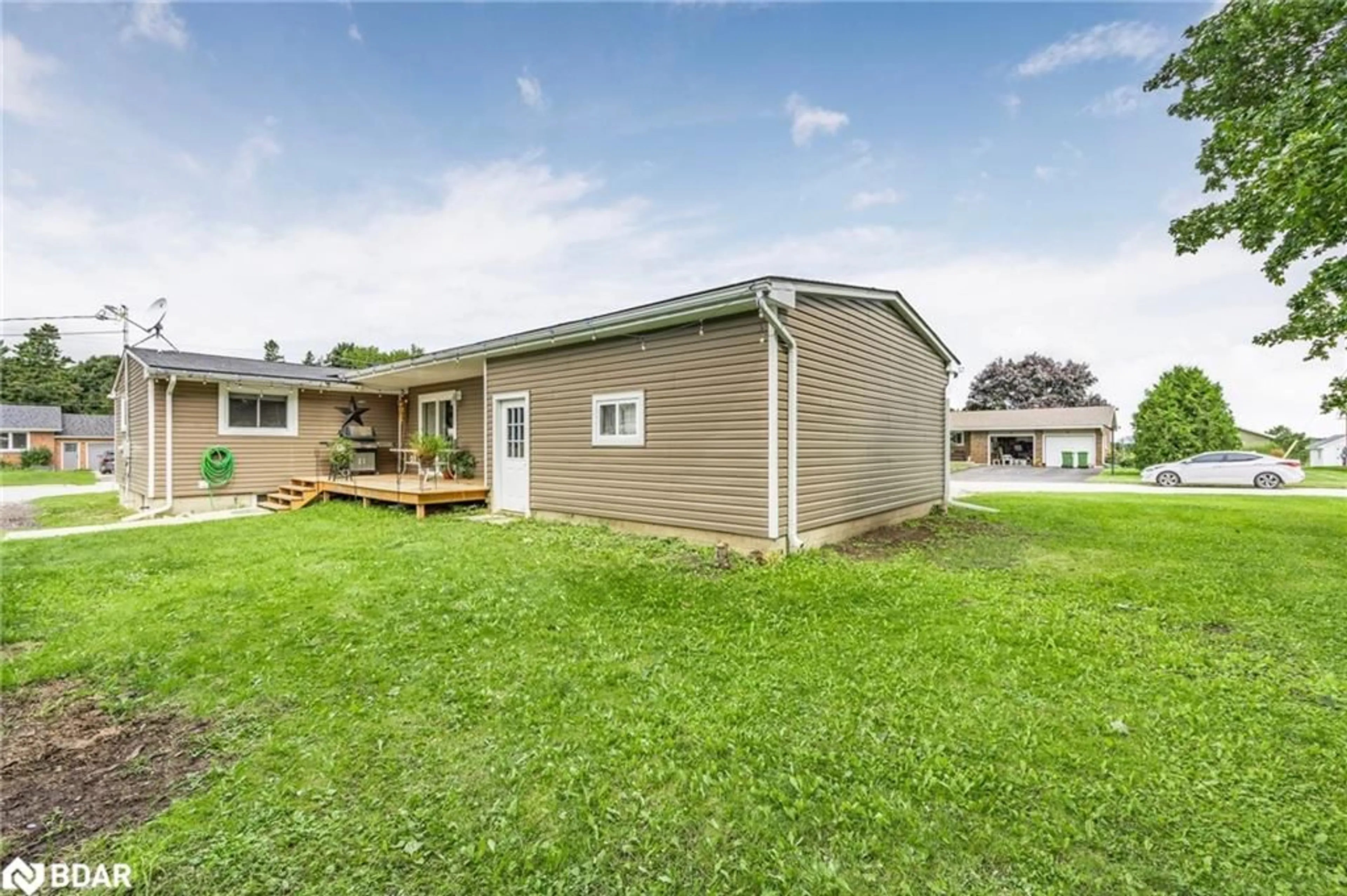 Frontside or backside of a home, the fenced backyard for 173 Main St, Markdale Ontario N0C 1H0