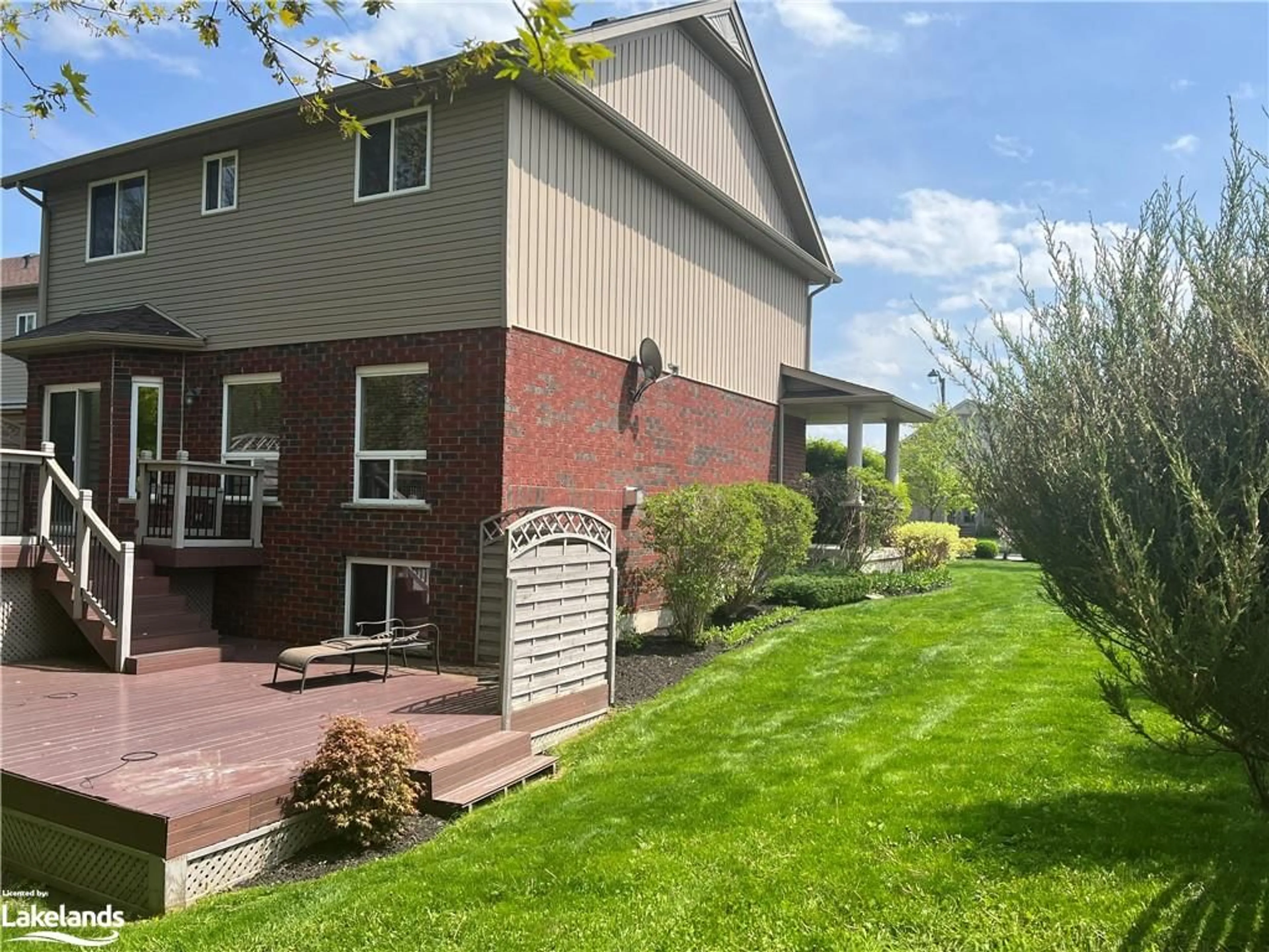 Frontside or backside of a home, the fenced backyard for 23 Chamberlain Cres, Collingwood Ontario L9Y 0E3