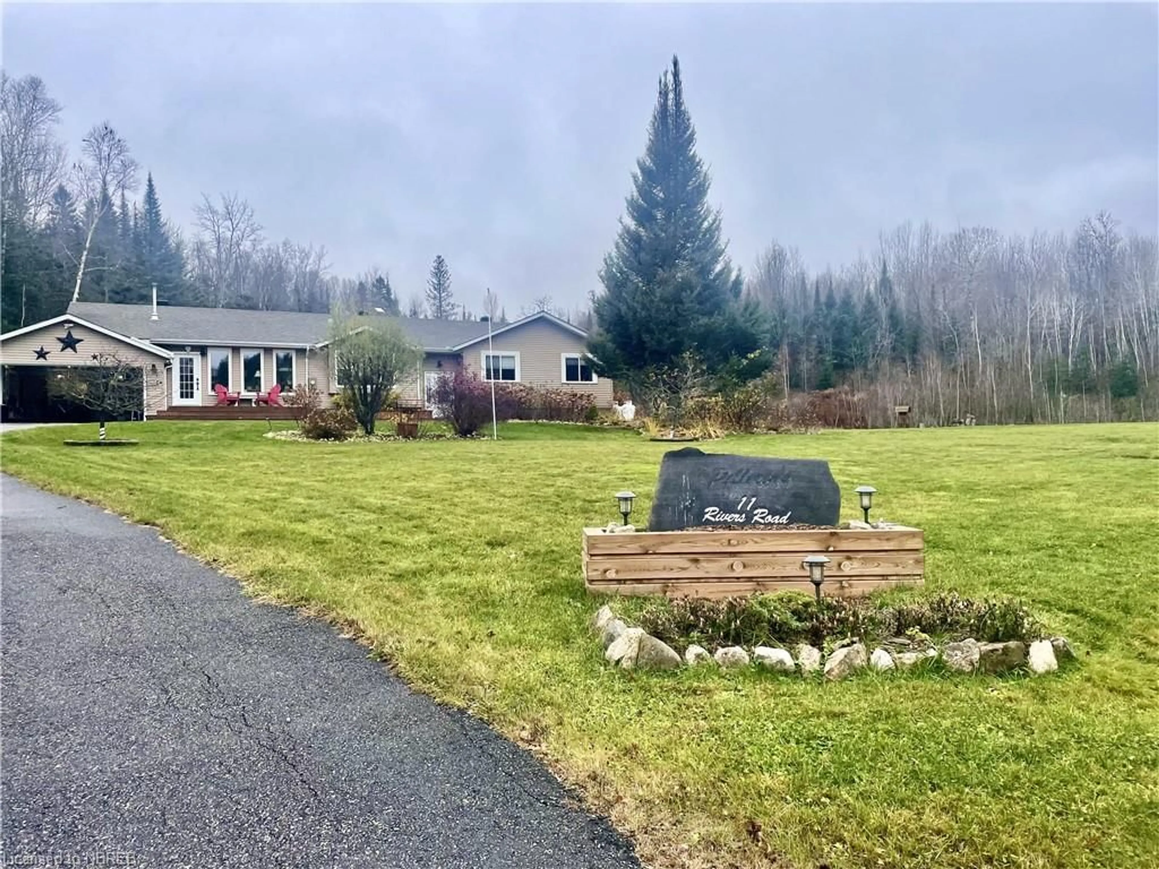 Frontside or backside of a home, the fenced backyard for 11 Rivers Rd, Callander Ontario P0H 1H0