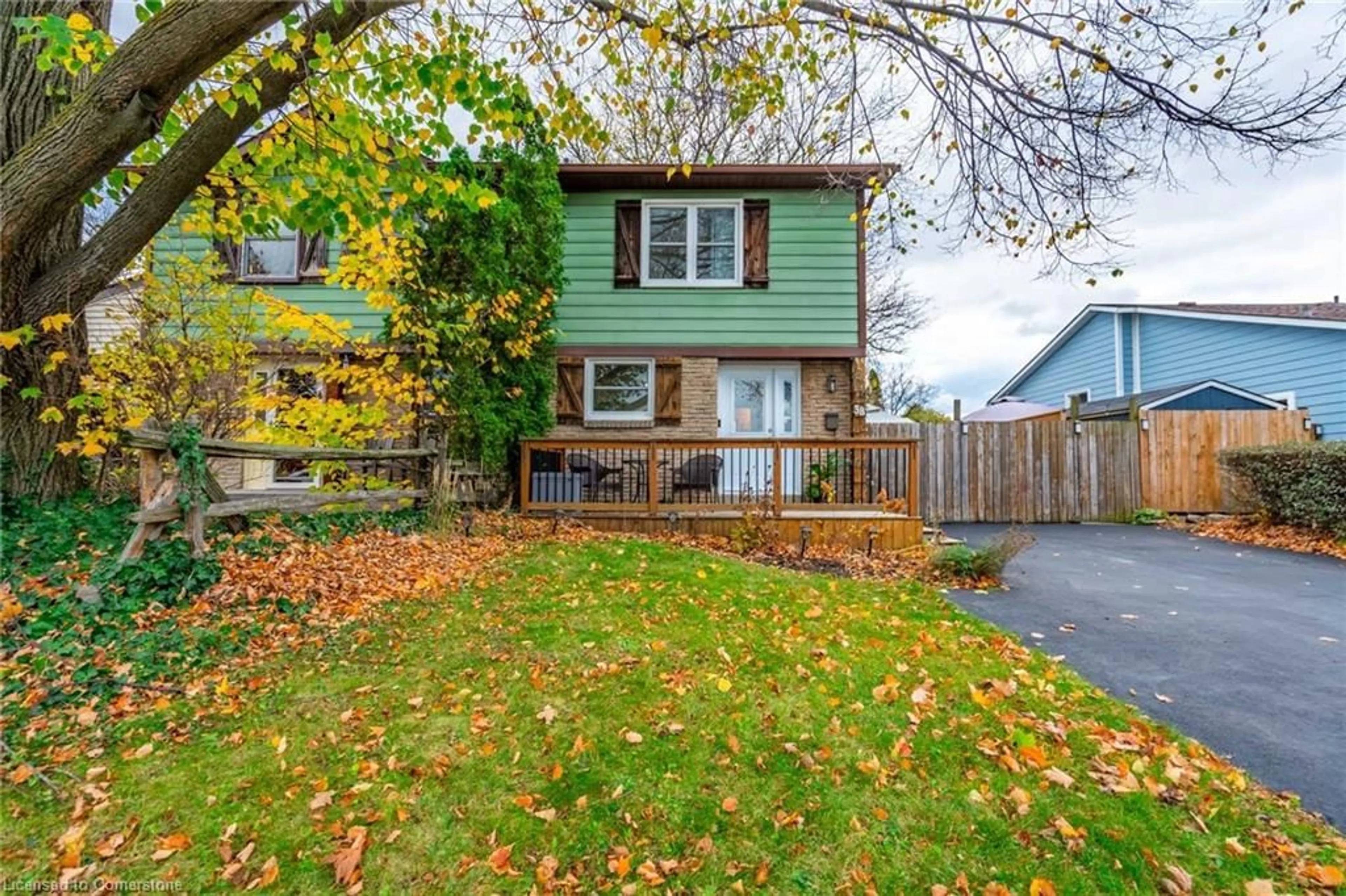 Frontside or backside of a home, the fenced backyard for 38 Golden Orchard Dr, Hamilton Ontario L9C 6J5