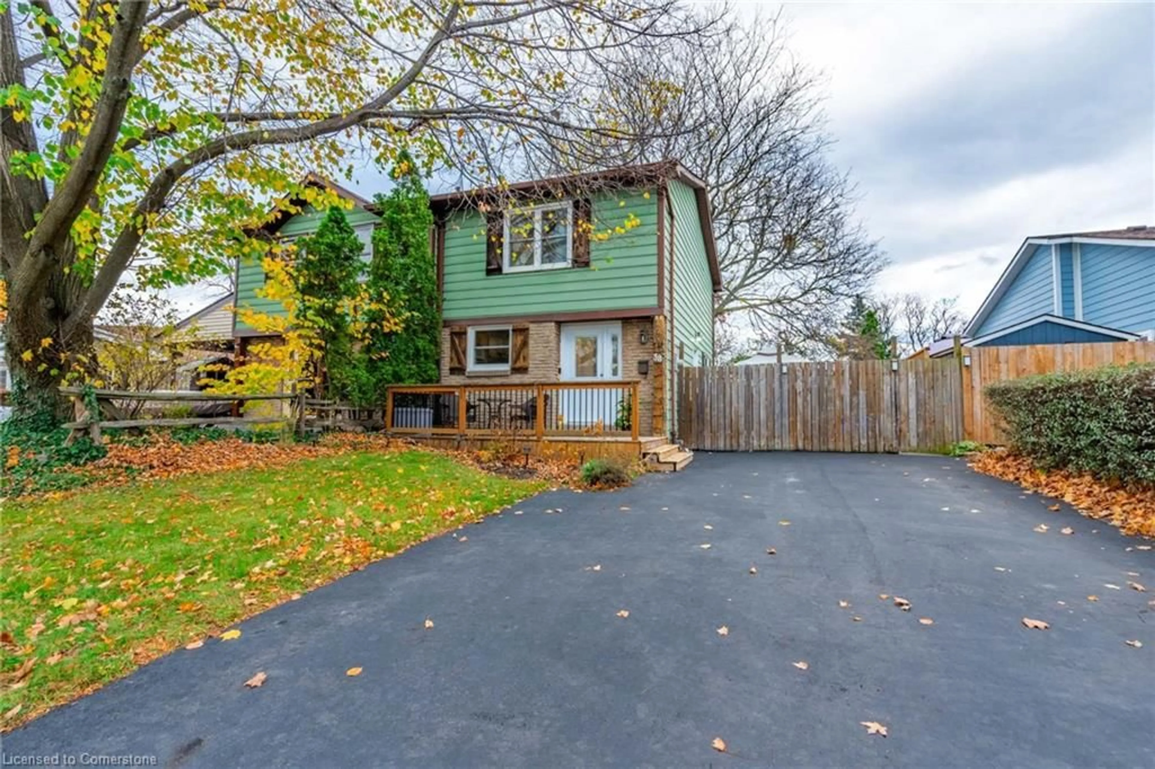 Frontside or backside of a home, the fenced backyard for 38 Golden Orchard Dr, Hamilton Ontario L9C 6J5