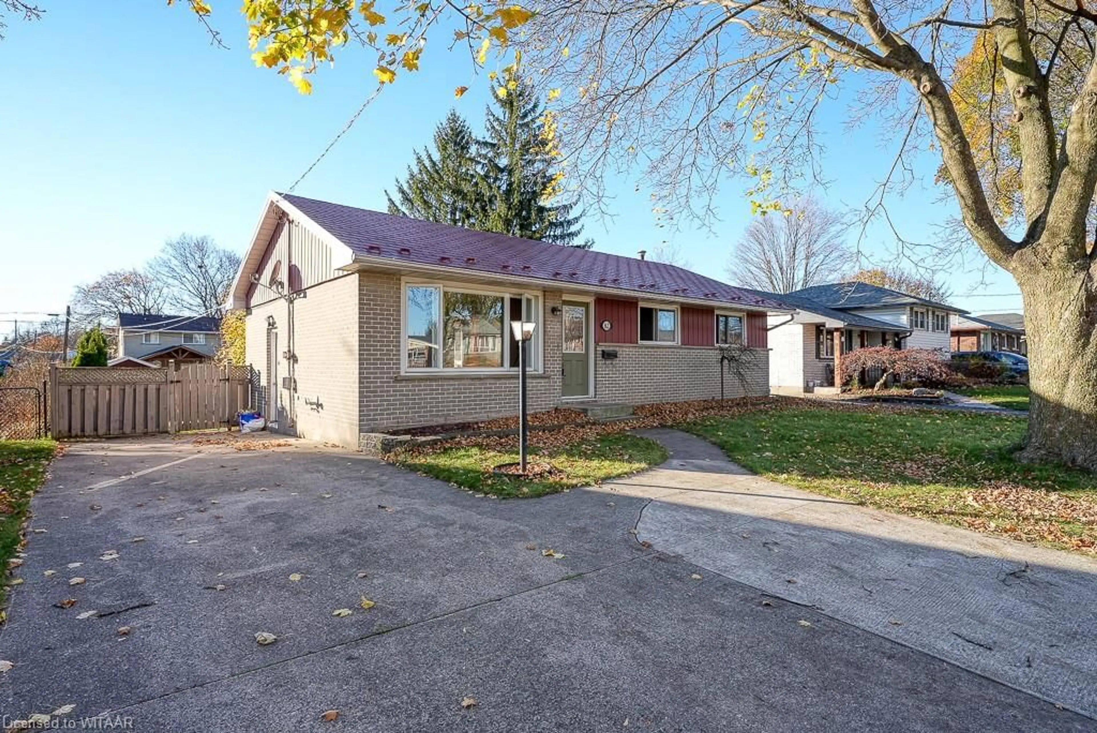 A pic from exterior of the house or condo, the fenced backyard for 82 Lyndale Cres, Woodstock Ontario N4S 7S9