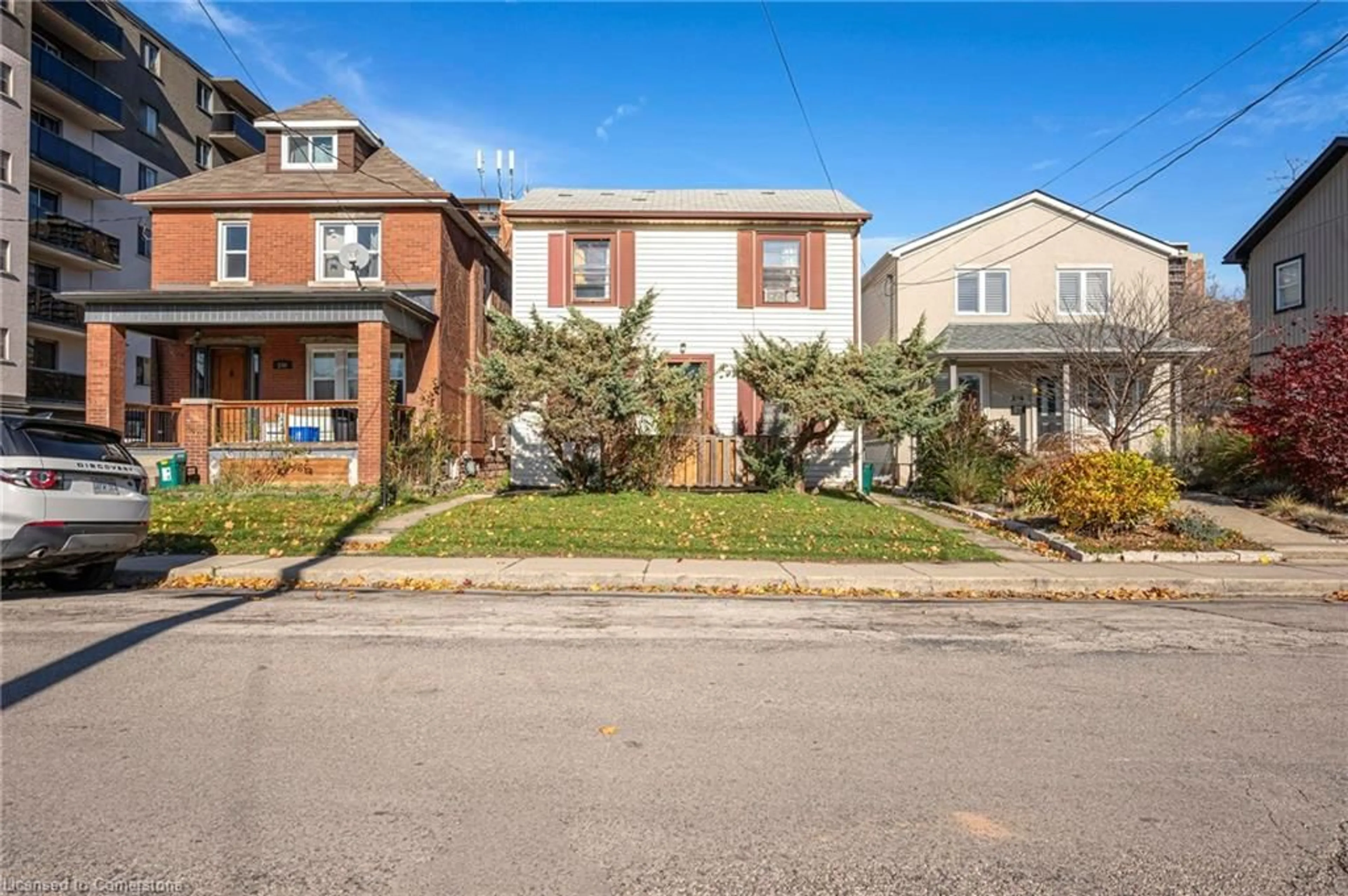 Frontside or backside of a home, the street view for 228 Duke St, Hamilton Ontario L8P 1Y3