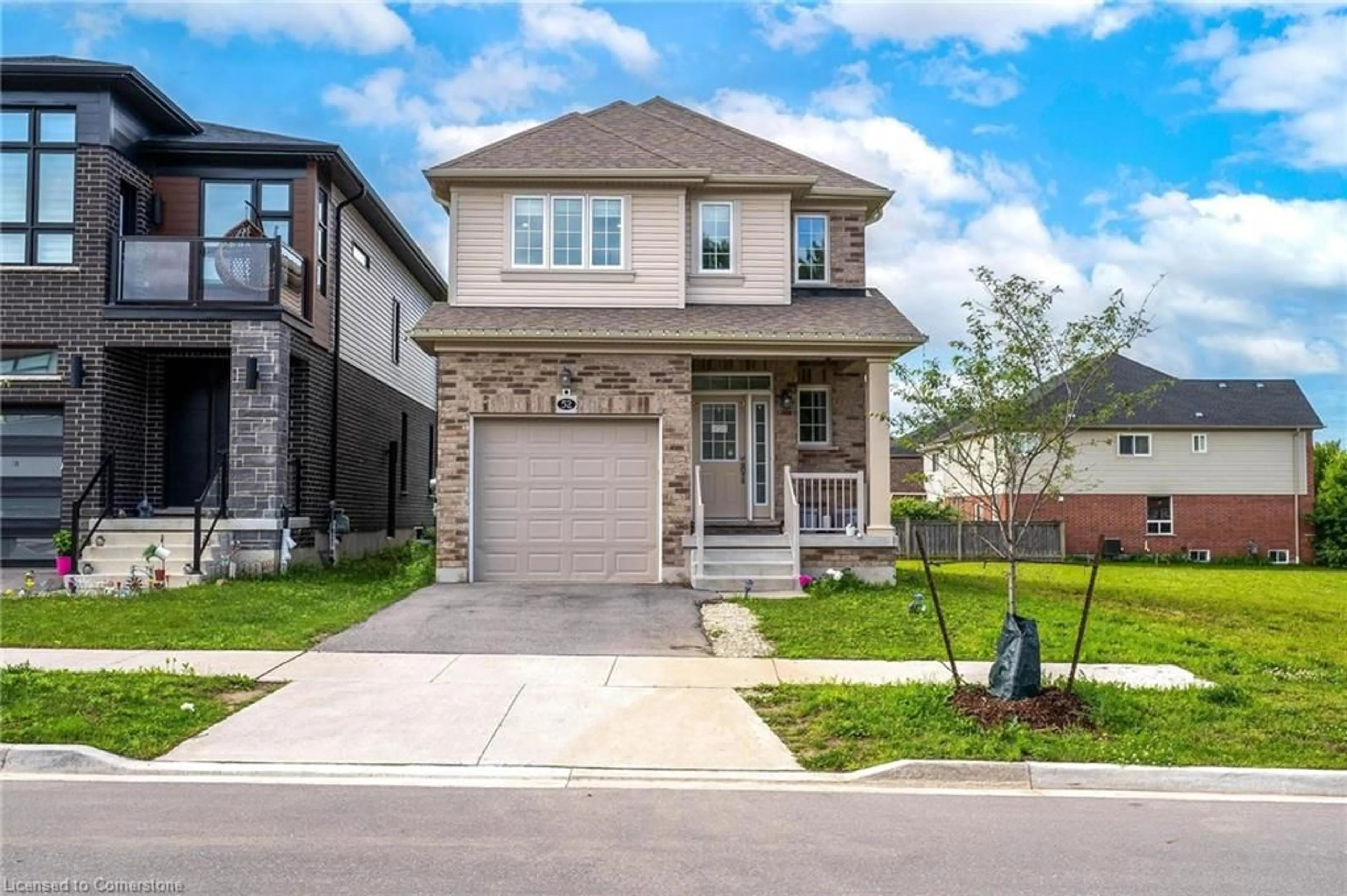 Home with brick exterior material, street for 52 Monarch Woods Dr, Kitchener Ontario N2P 2Y9