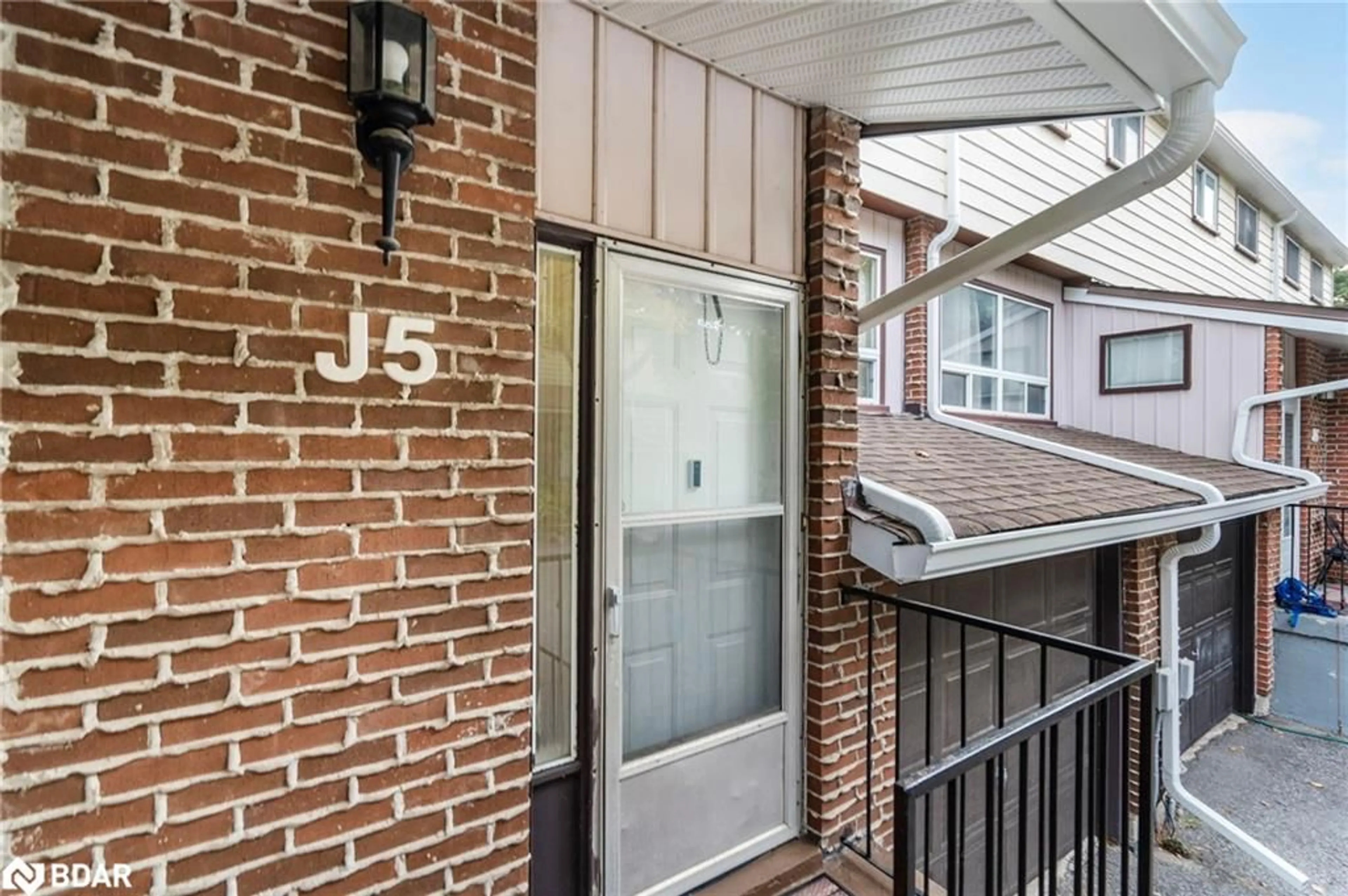 A pic from exterior of the house or condo, the street view for 63 Ferris Lane #J5, Barrie Ontario L4M 5C4