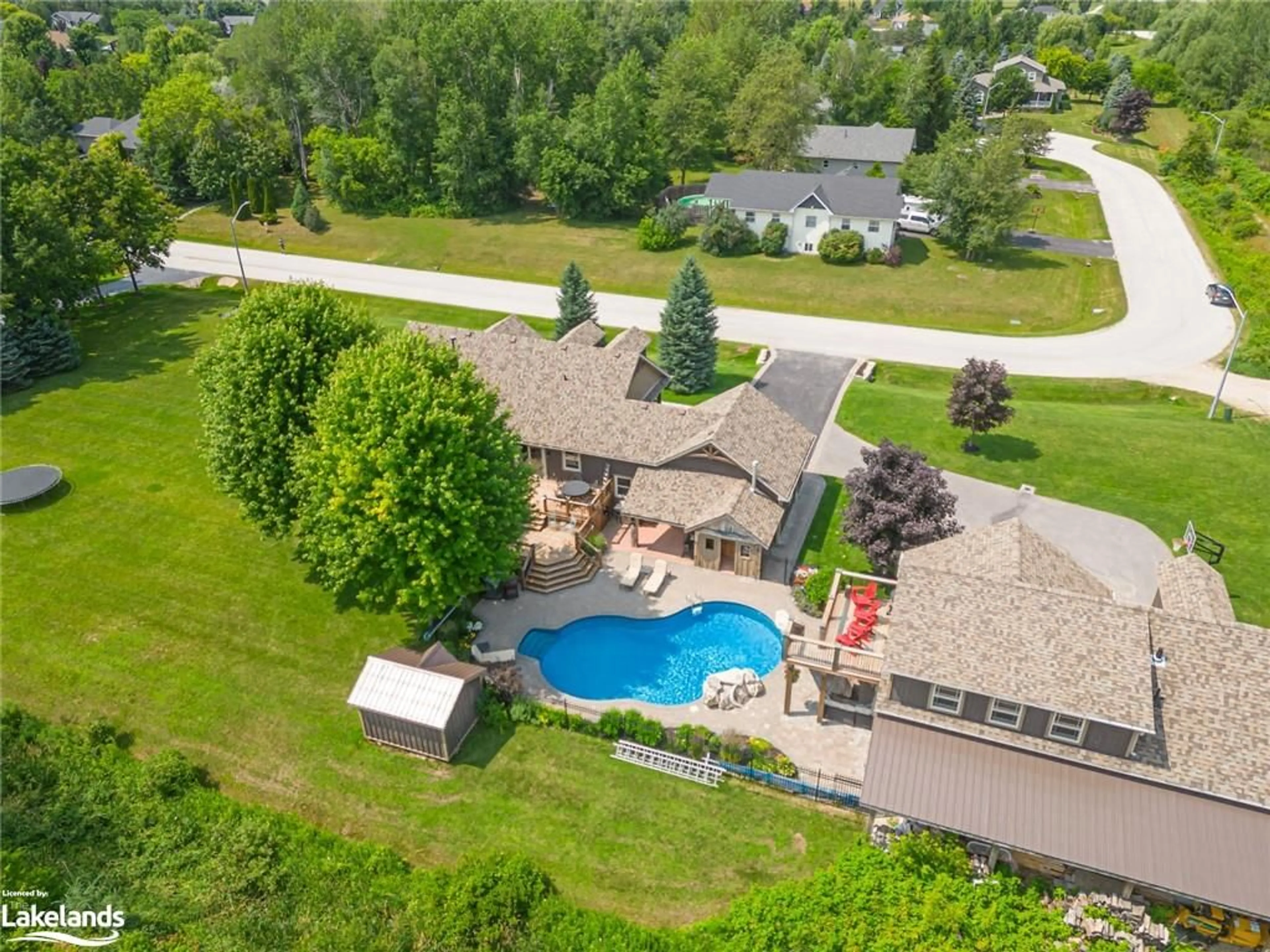 Frontside or backside of a home, the fenced backyard for 47 Blackburn Ave, Nottawa Ontario L0M 1P0