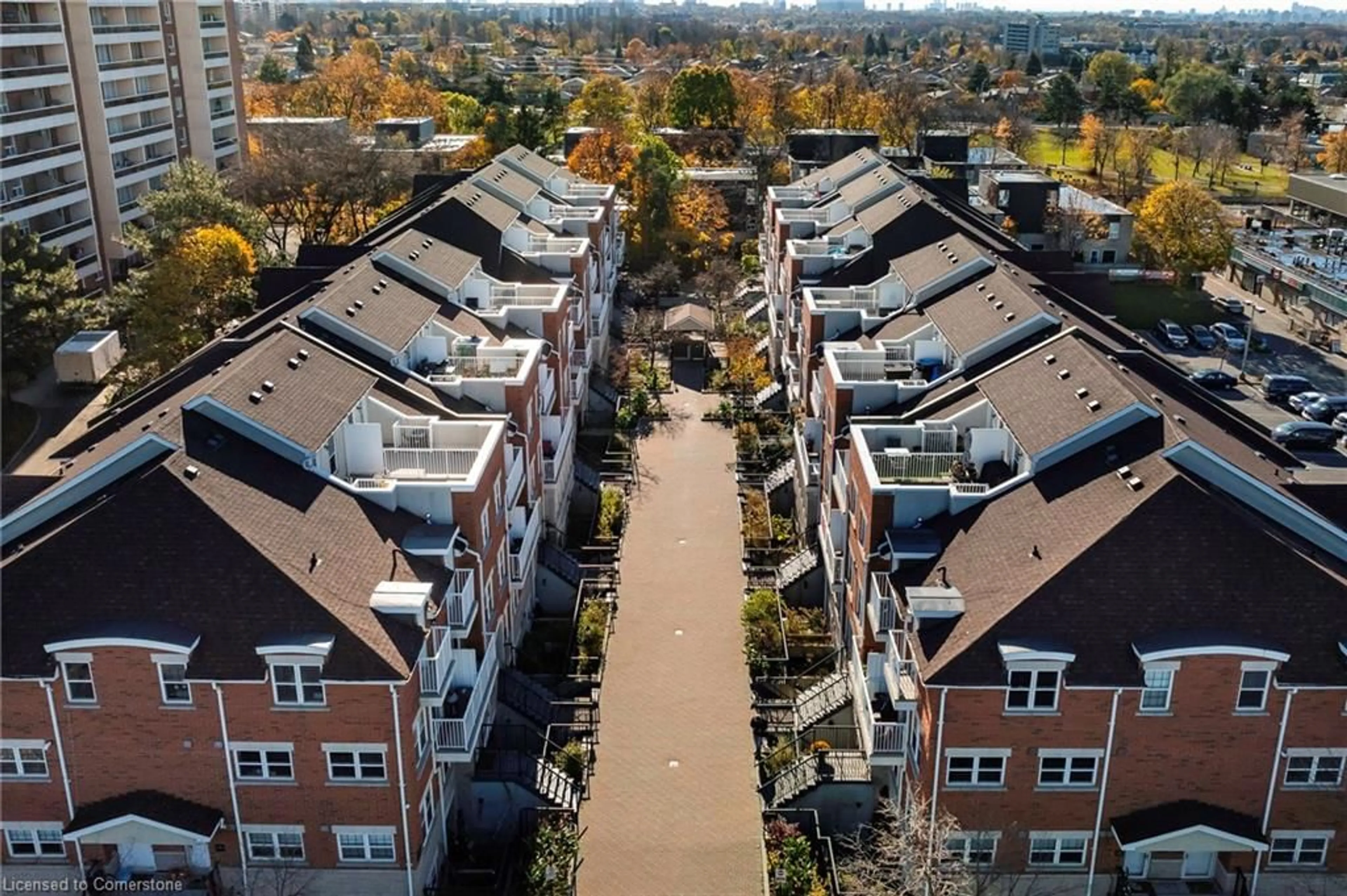 A pic from exterior of the house or condo, the view of city buildings for 37 Four Winds Dr #108, Toronto Ontario M3J 1K7