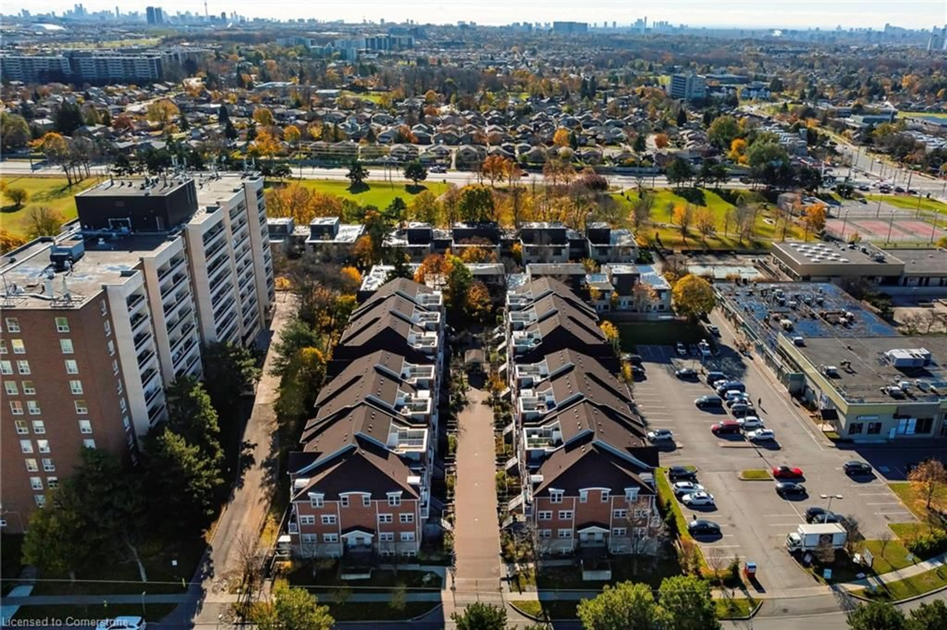 A pic from exterior of the house or condo, the view of city buildings for 37 Four Winds Dr #108, Toronto Ontario M3J 1K7