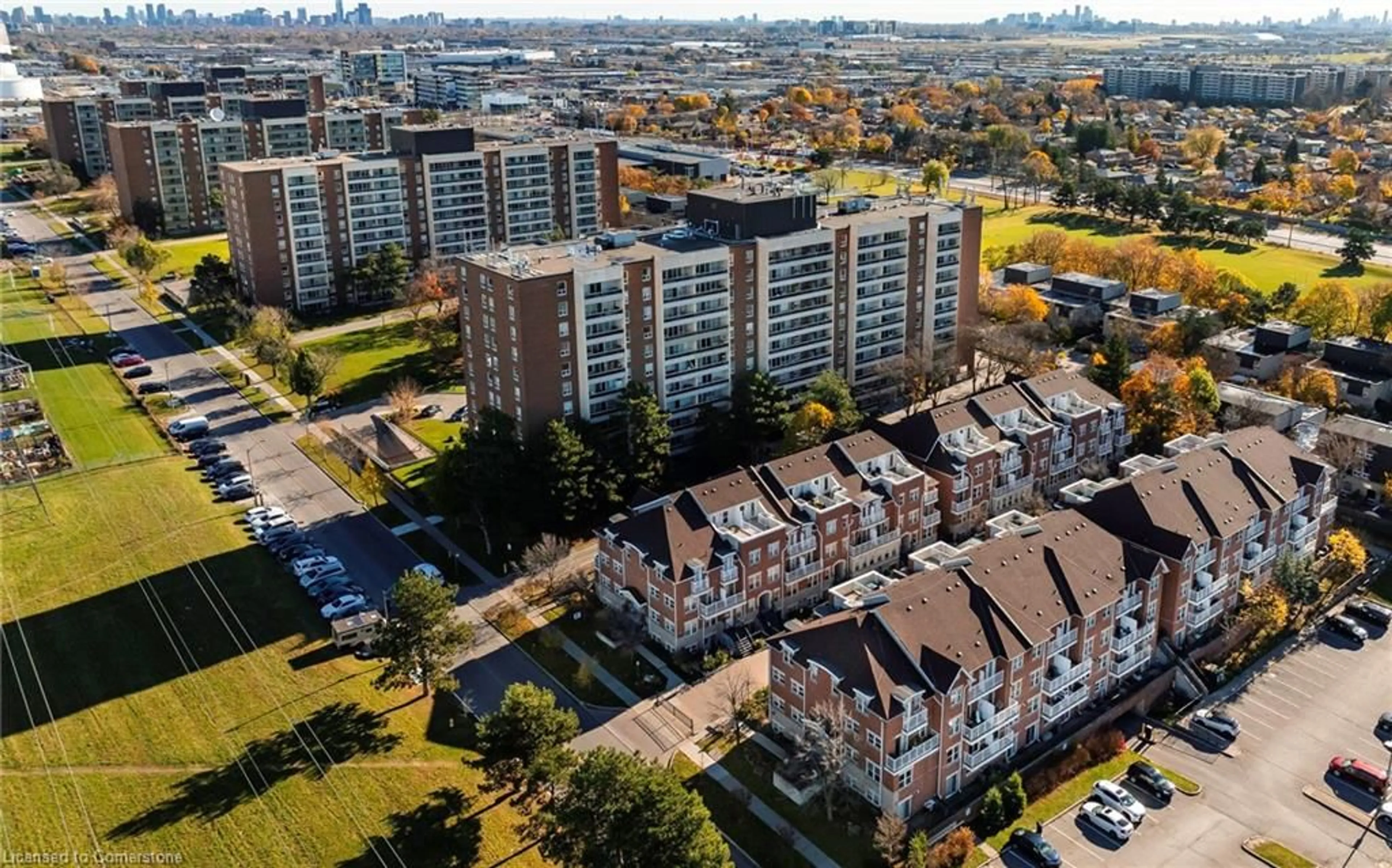 A pic from exterior of the house or condo, the view of city buildings for 37 Four Winds Dr #108, Toronto Ontario M3J 1K7