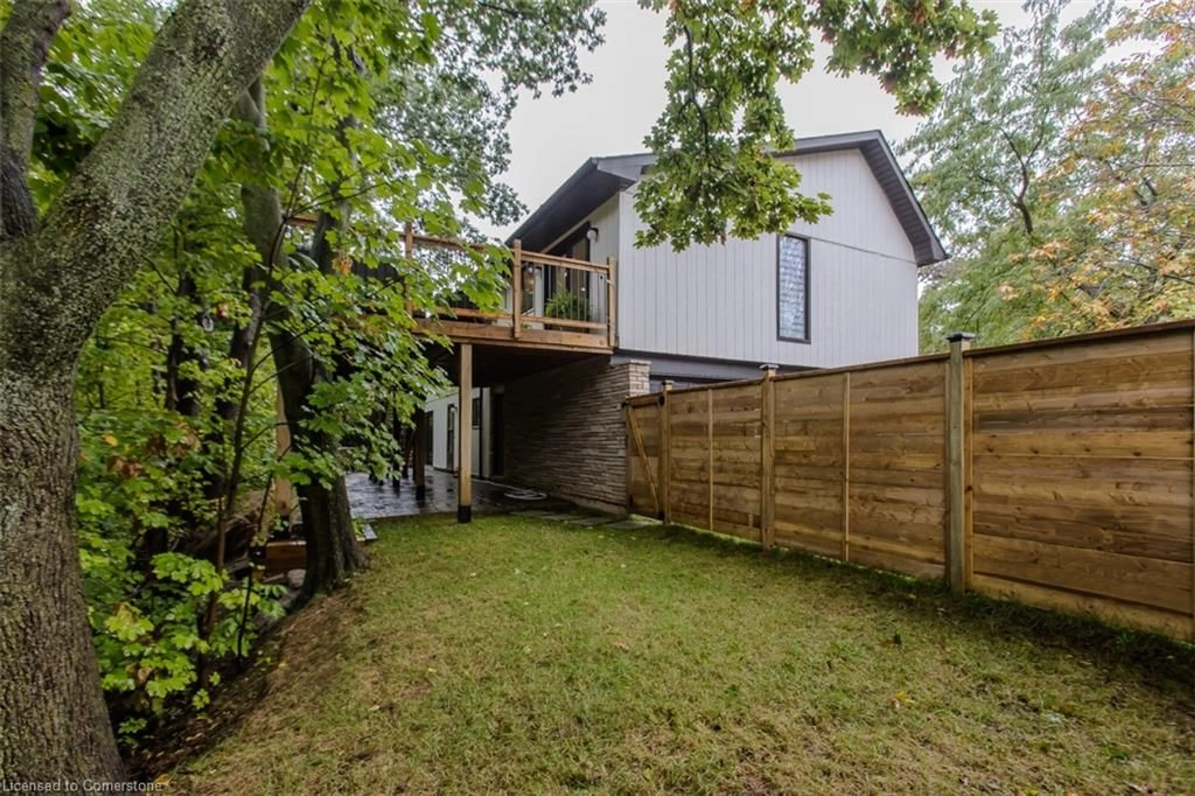 Frontside or backside of a home, the fenced backyard for 1891 Heather Hills Dr, Burlington Ontario L7P 2Z1