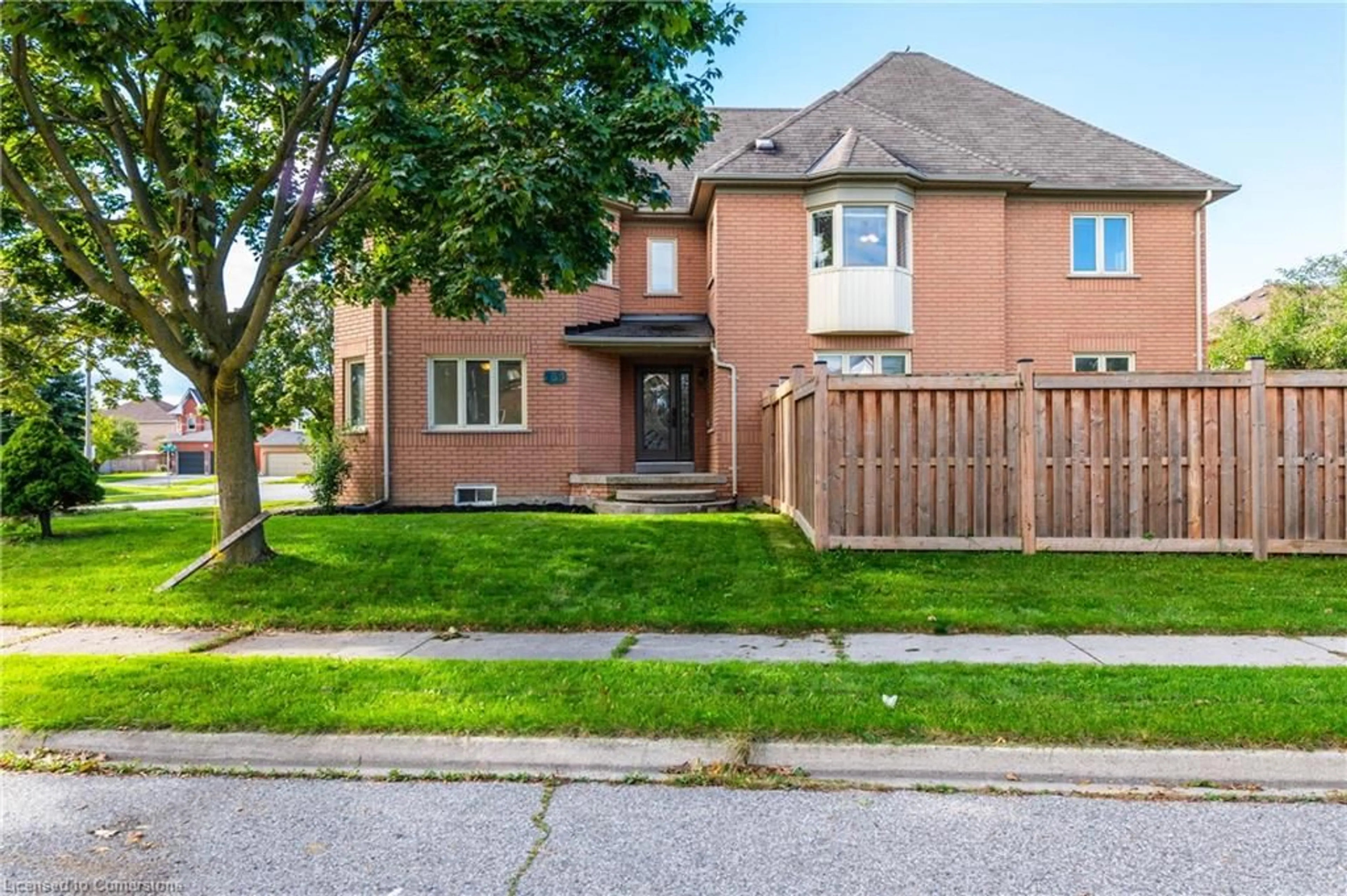 A pic from exterior of the house or condo, the fenced backyard for 139 Shady Pine Cir, Brampton Ontario L6R 1N6