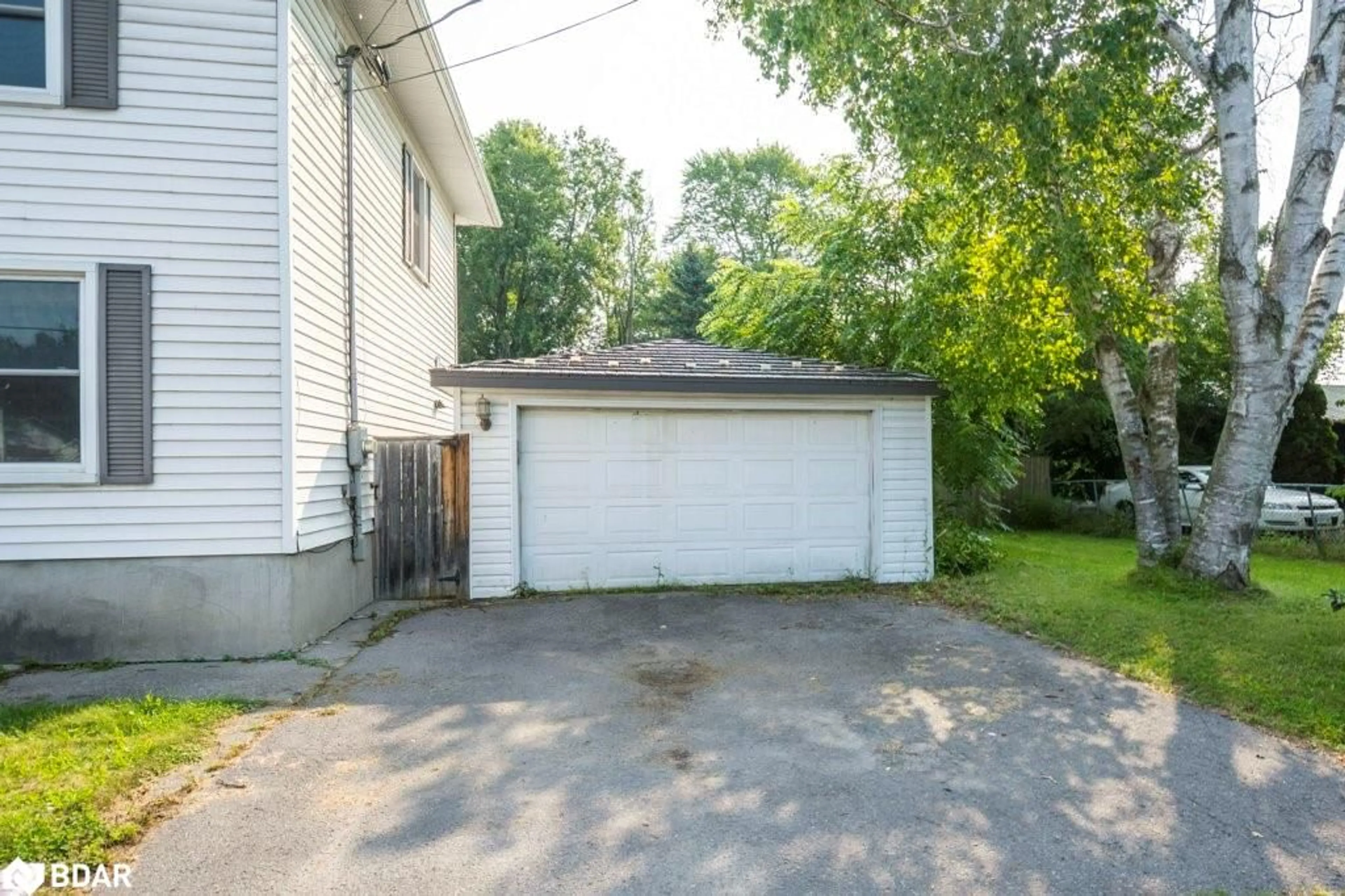 Frontside or backside of a home, the fenced backyard for 48 North Trent St, Frankford Ontario K0K 2C0