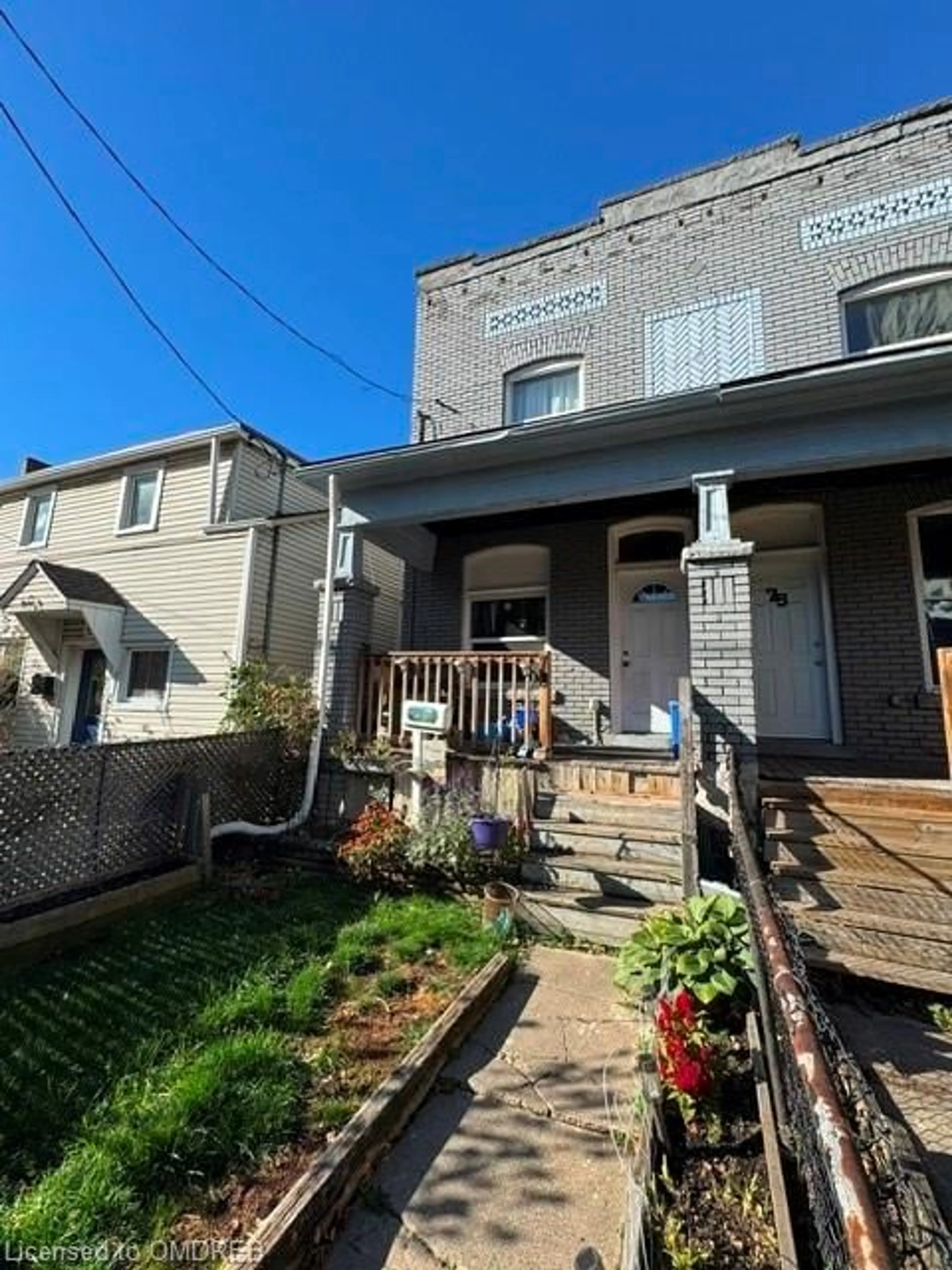 A pic from exterior of the house or condo, the fenced backyard for 73 Cathcart St, Hamilton Ontario L8R 1M6